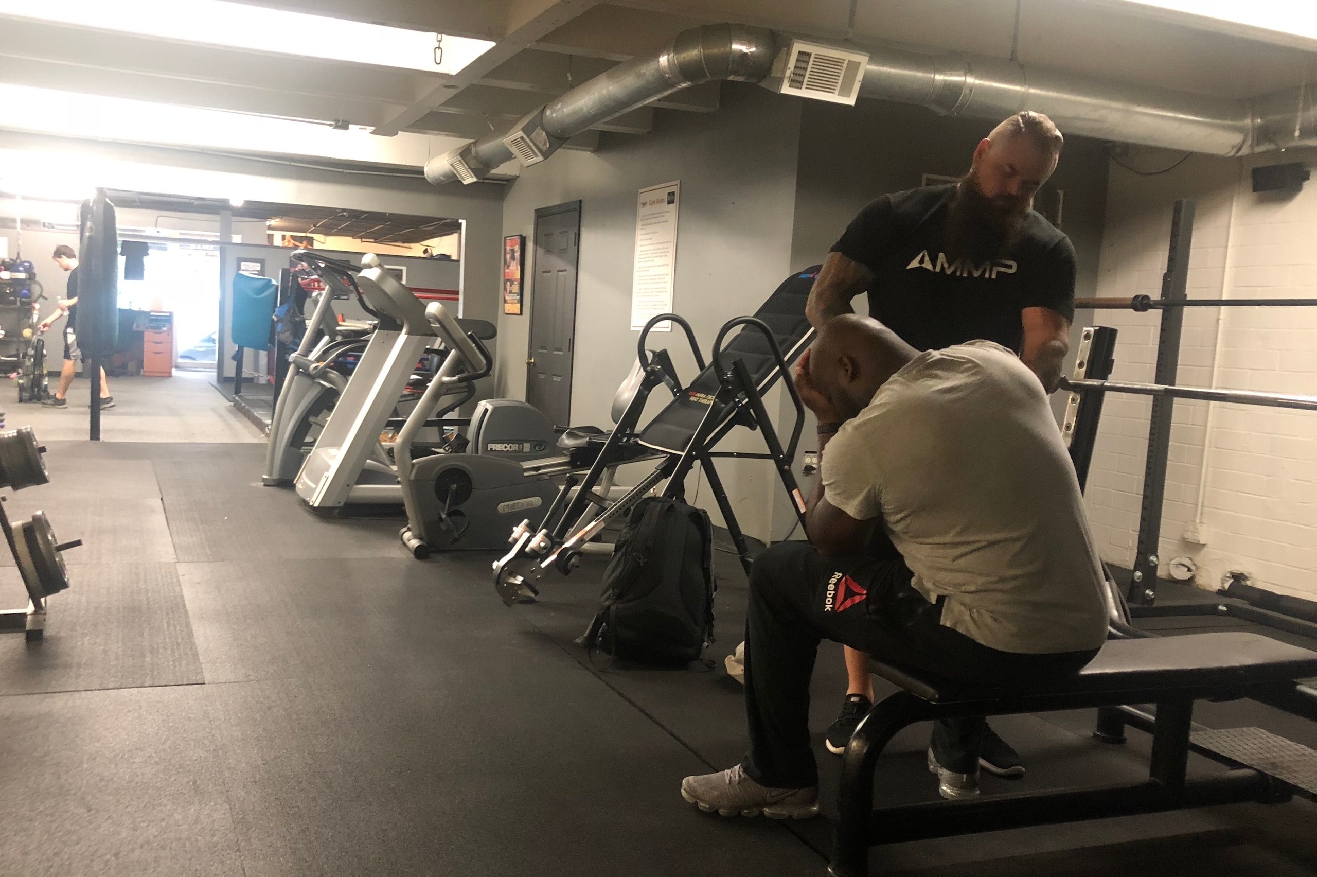Lewis and strength coach Jimmy Gerland pushing through training for Saturday's fight.