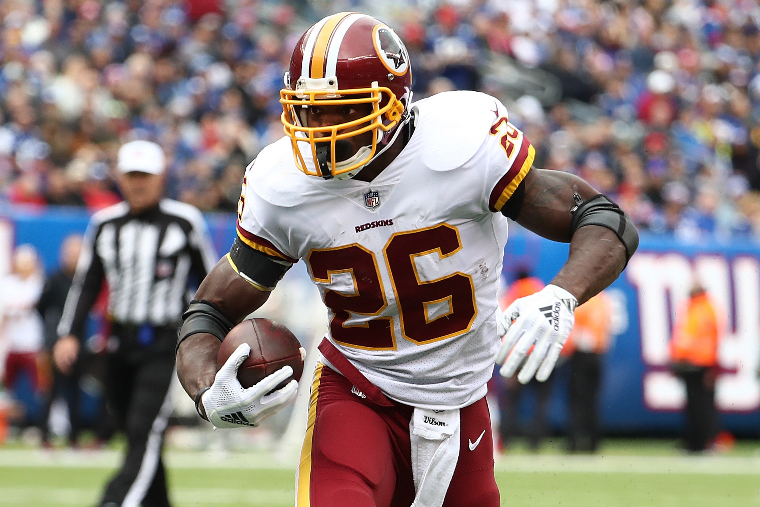 EAST RUTHERFORD, NJ - OCTOBER 28:  Adrian Peterson #26 of the Washington Redskins scores a touchdown against Nate Stupar #57 of the New York Giants during their game at MetLife Stadium on October 28, 2018 in East Rutherford, New Jersey.  (Photo by Al Bell