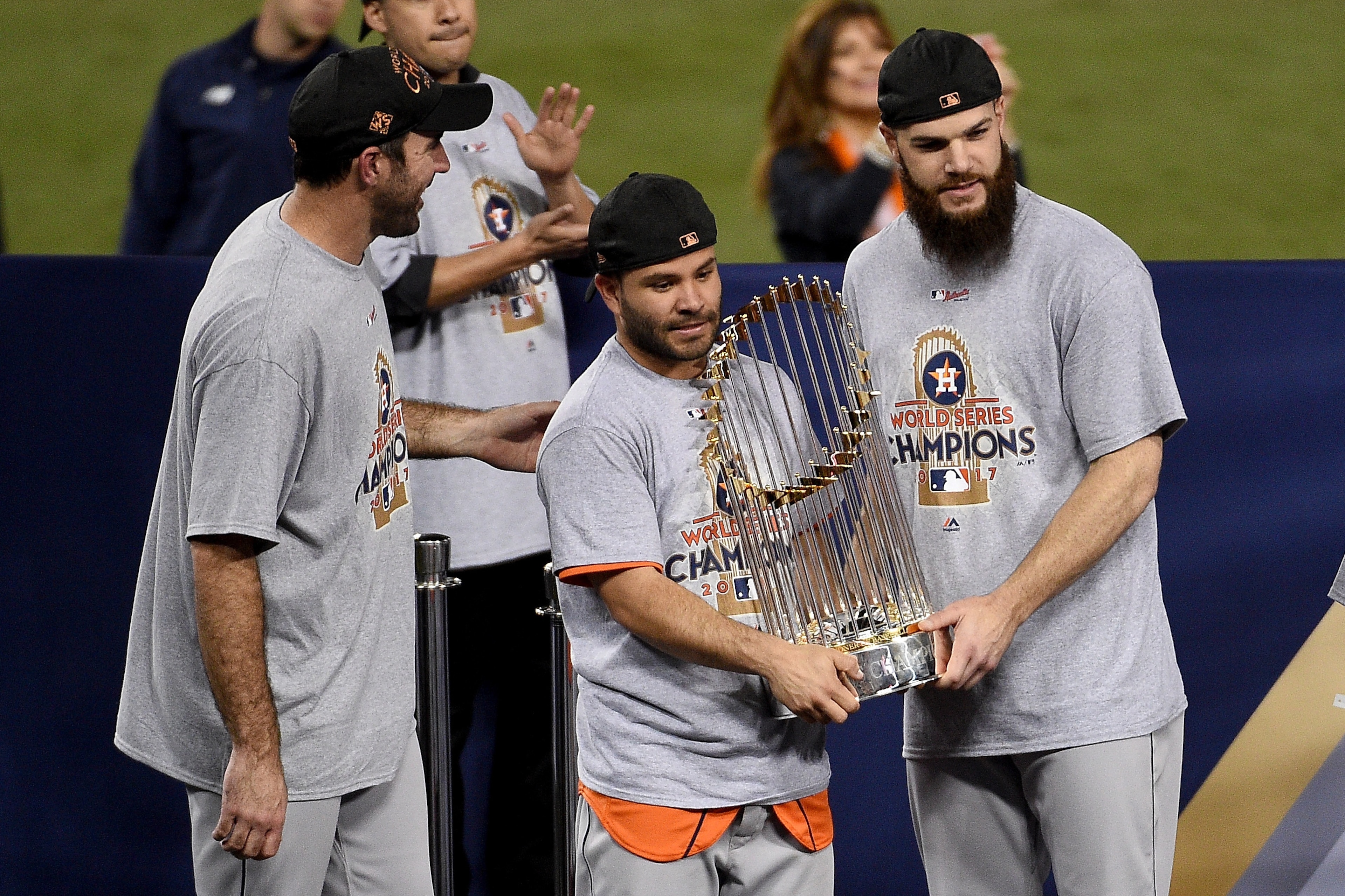 LOS ANGELES, CA - NOVEMBER 01:  (L-R) Justin Verlander #35, Jose Altuve #27, and Dallas Keuchel #60 of the Houston Astros hold the Commissioner's Trophy after defeating the Los Angeles Dodgers 5-1 in game seven to win the 2017 World Series at Dodger Stadi