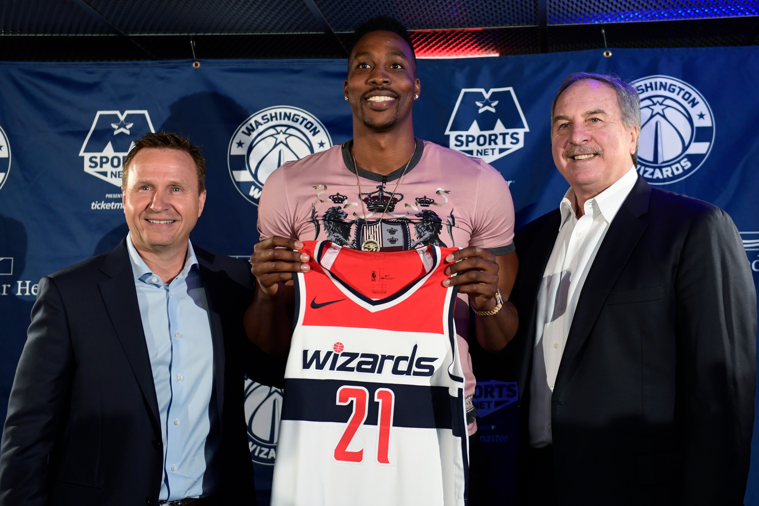 Head coach Scott Brooks (left), Dwight Howard and general manager Ernie Grunfeld.