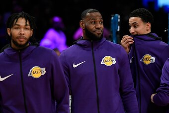 LOS ANGELES, CA - OCTOBER 20: LeBron James #23 of the Los Angeles Lakers makes his home debut with Brandon Ingram #14 and Kyle Kuzma #0 of the Los Angeles Lakers looking on against the Houston Rockets at Staples Center on October 20, 2018 in Los Angeles, 