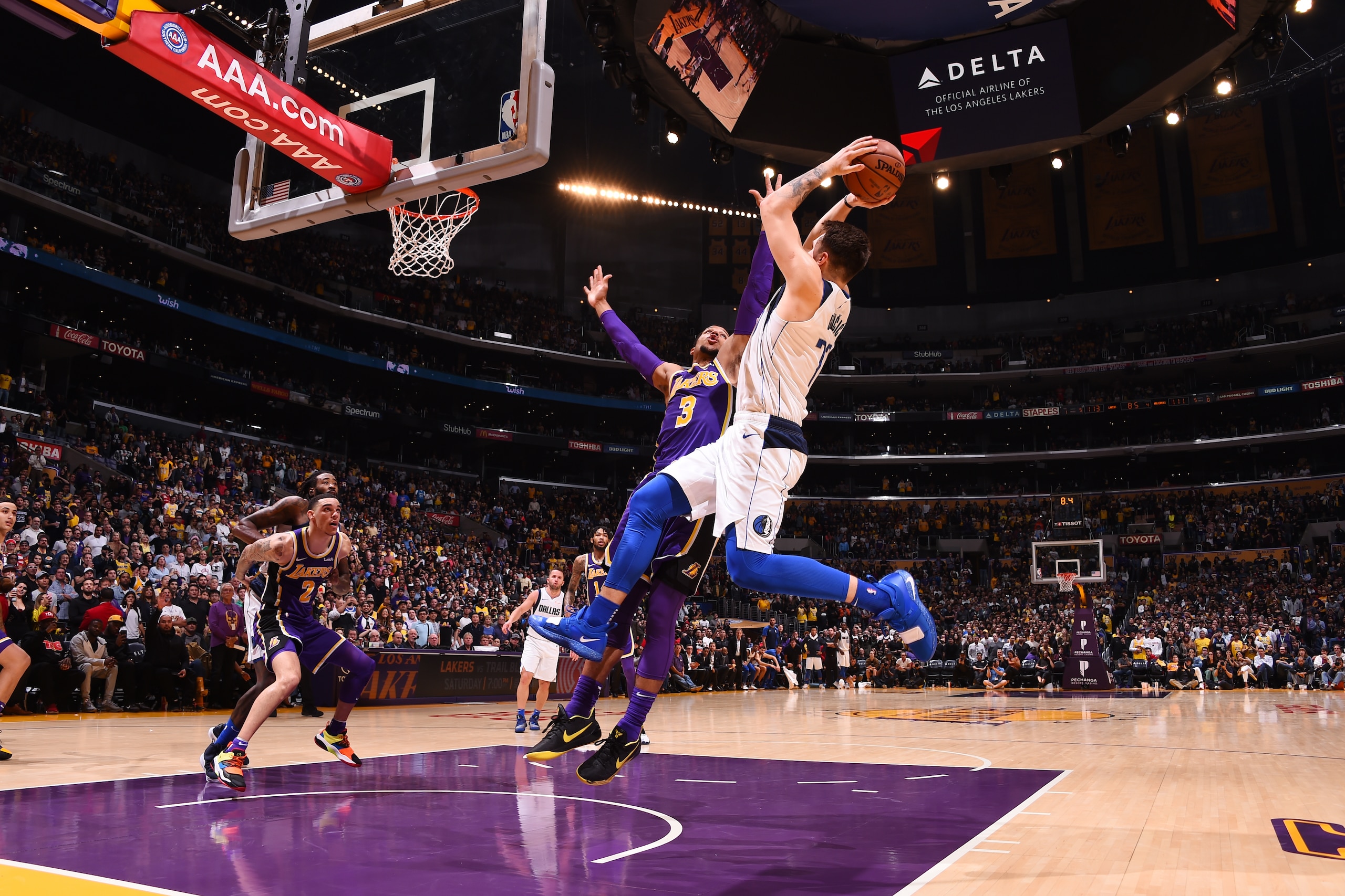 LOS ANGELES, CA - OCTOBER 31: Luka Doncic #77 of the Dallas Mavericks shoots the ball against the Los Angeles Lakers on October 31, 2018 at STAPLES Center in Los Angeles, California. NOTE TO USER: User expressly acknowledges and agrees that, by downloadi LOS ANGELES, CA - OCTOBER 31: Luka Doncic #77 of the Dallas Mavericks shoots the ball against the Los Angeles Lakers on October 31, 2018 at STAPLES Center in Los Angeles, California. NOTE TO USER: User expressly acknowledges and agrees that, by downloadi