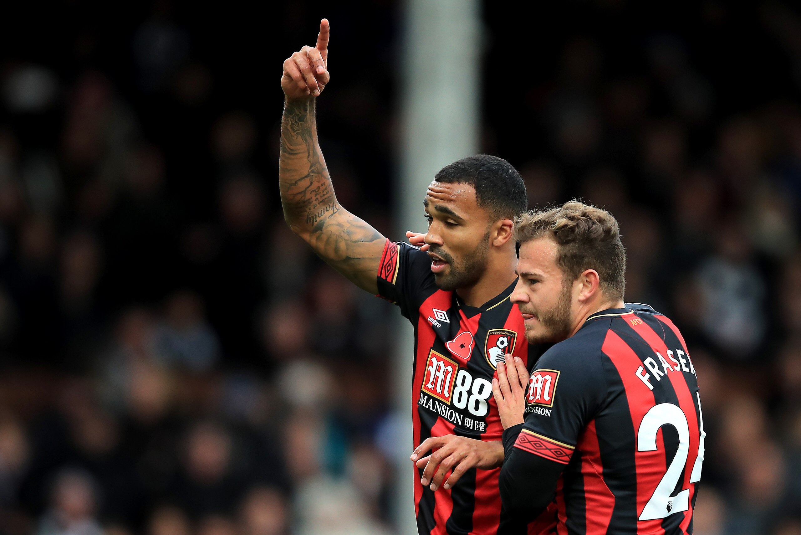 LONDON, ENGLAND - OCTOBER 27: Callum Wilson of AFC Bournemouth celebrates with teammate Ryan Fraser after scoring a penalty for his team's first goal during the Premier League match between Fulham FC and AFC Bournemouth at Craven Cottage on October 27, 2 LONDON, ENGLAND - OCTOBER 27: Callum Wilson of AFC Bournemouth celebrates with teammate Ryan Fraser after scoring a penalty for his team's first goal during the Premier League match between Fulham FC and AFC Bournemouth at Craven Cottage on October 27, 2