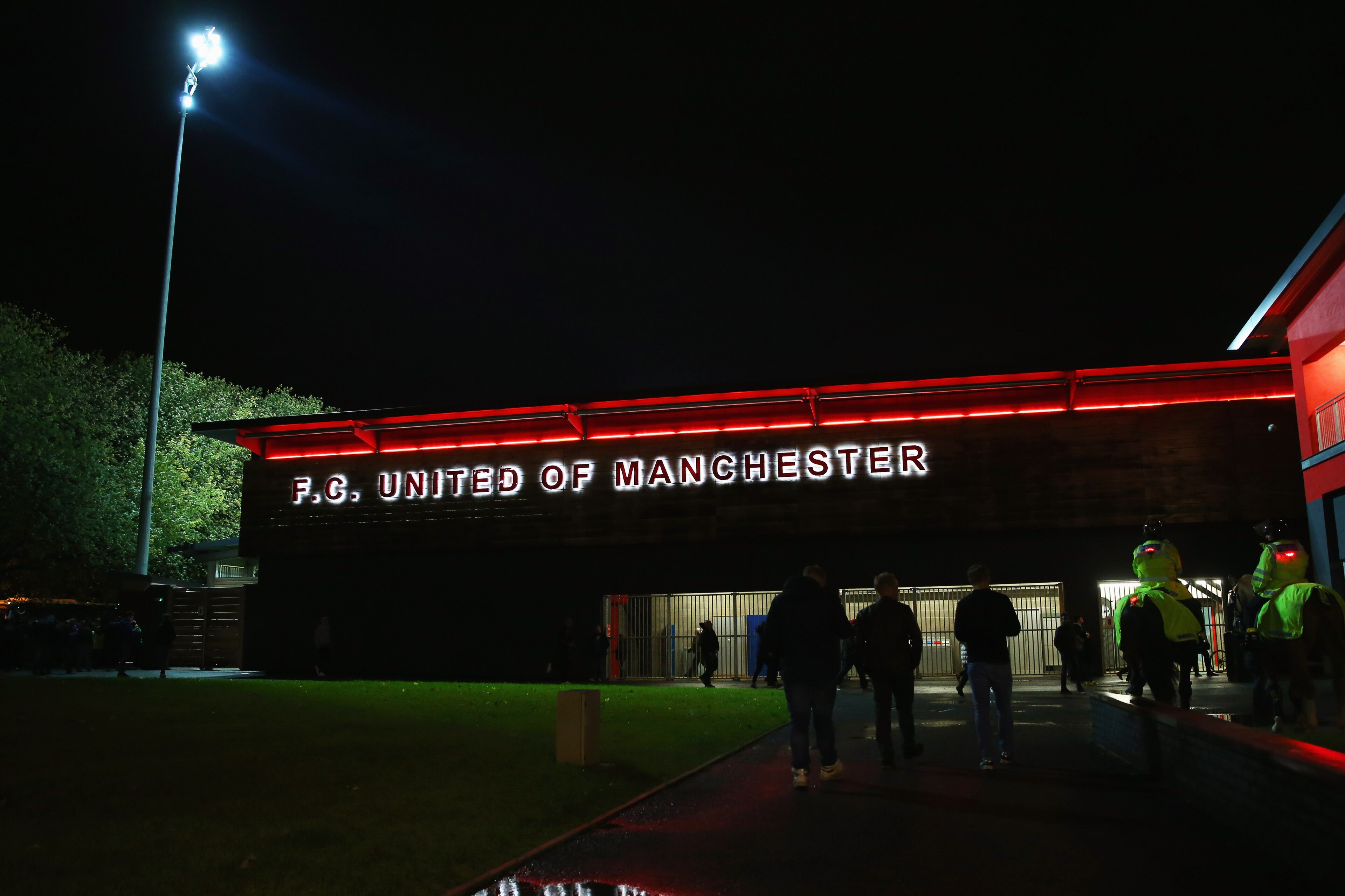MANCHESTER, ENGLAND - NOVEMBER 09:  Fans walk outside the stadium prior to the Emirates FA Cup first round match between FC United of Manchester and Chesterfield at Broadhurst Park on November 9, 2015 in Manchester, England.  (Photo by Alex Livesey/Getty 