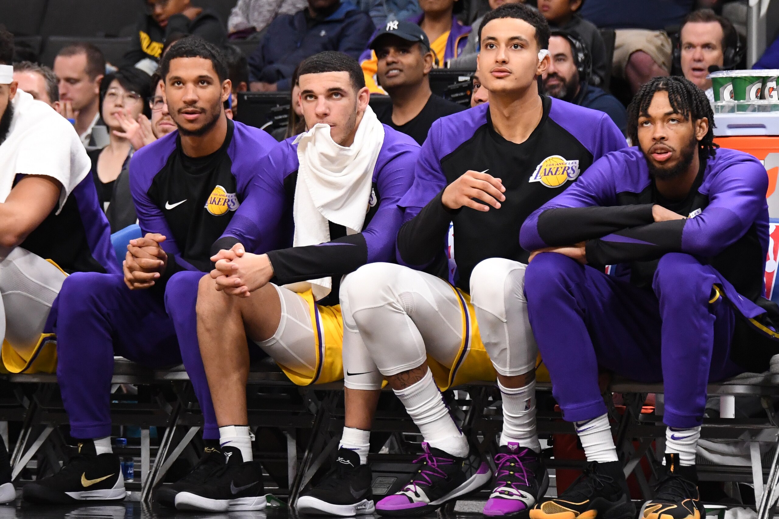 SAN JOSE, CA - OCTOBER 12: Josh Hart #3, Lonzo Ball #2, Kyle Kuzma #0 and Brandon Ingram #14 of the Los Angeles Lakers look on from the bench during a pre-season game against the Golden State Warriors on October 12, 2018 at the SAP Center in San Jose, Cal