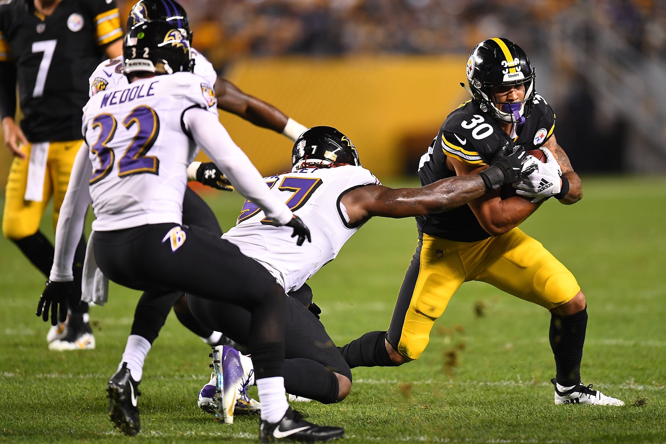 PITTSBURGH, PA - SEPTEMBER 30: James Conner #30 of the Pittsburgh Steelers carries the ball against the Baltimore Ravens in the first half during the game at Heinz Field on September 30, 2018 in Pittsburgh, Pennsylvania. (Photo by Joe Sargent/Getty Images