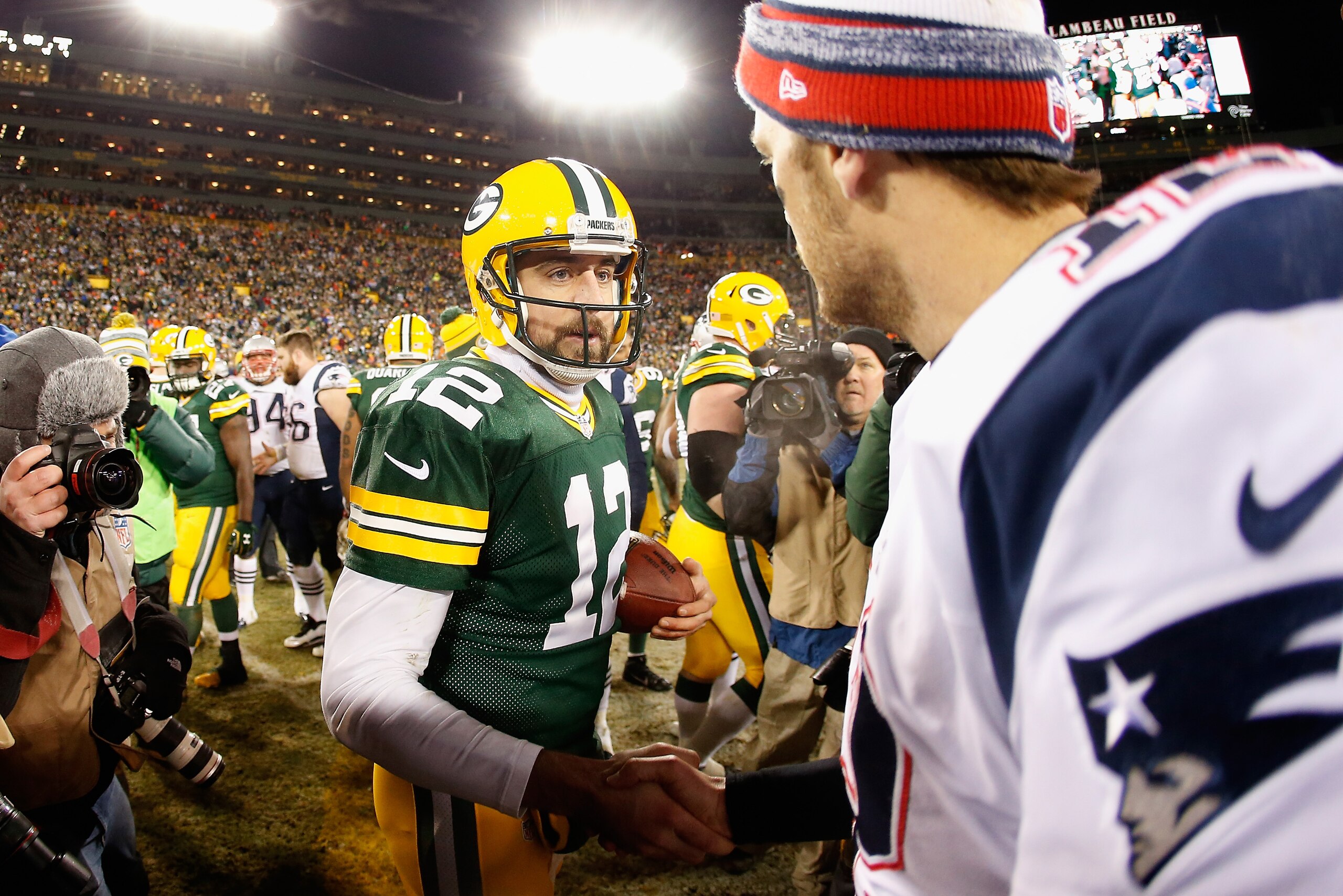 GREEN BAY, WI - NOVEMBER 30:  Quarterbacks Aaron Rodgers #12 of the Green Bay Packers and Tom Brady #12 of the New England Patriots shake hands following the NFL game at Lambeau Field on November 30, 2014 in Green Bay, Wisconsin. The Packers defeated the 