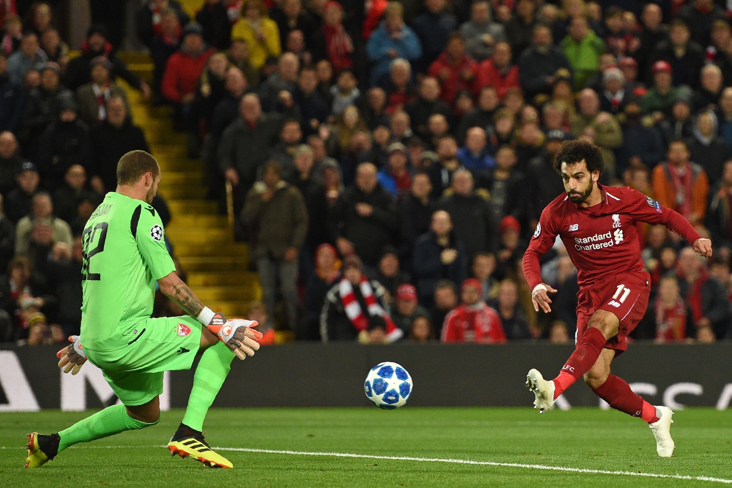 Liverpool's Egyptian midfielder Mohamed Salah (R) has an unsuccessful shot as Red Star Belgrade's Yugoslavian-born Canadian goalkeeper Milan Borjan prepares to make a save during the UEFA Champions League group C football match between Liverpool and Red S