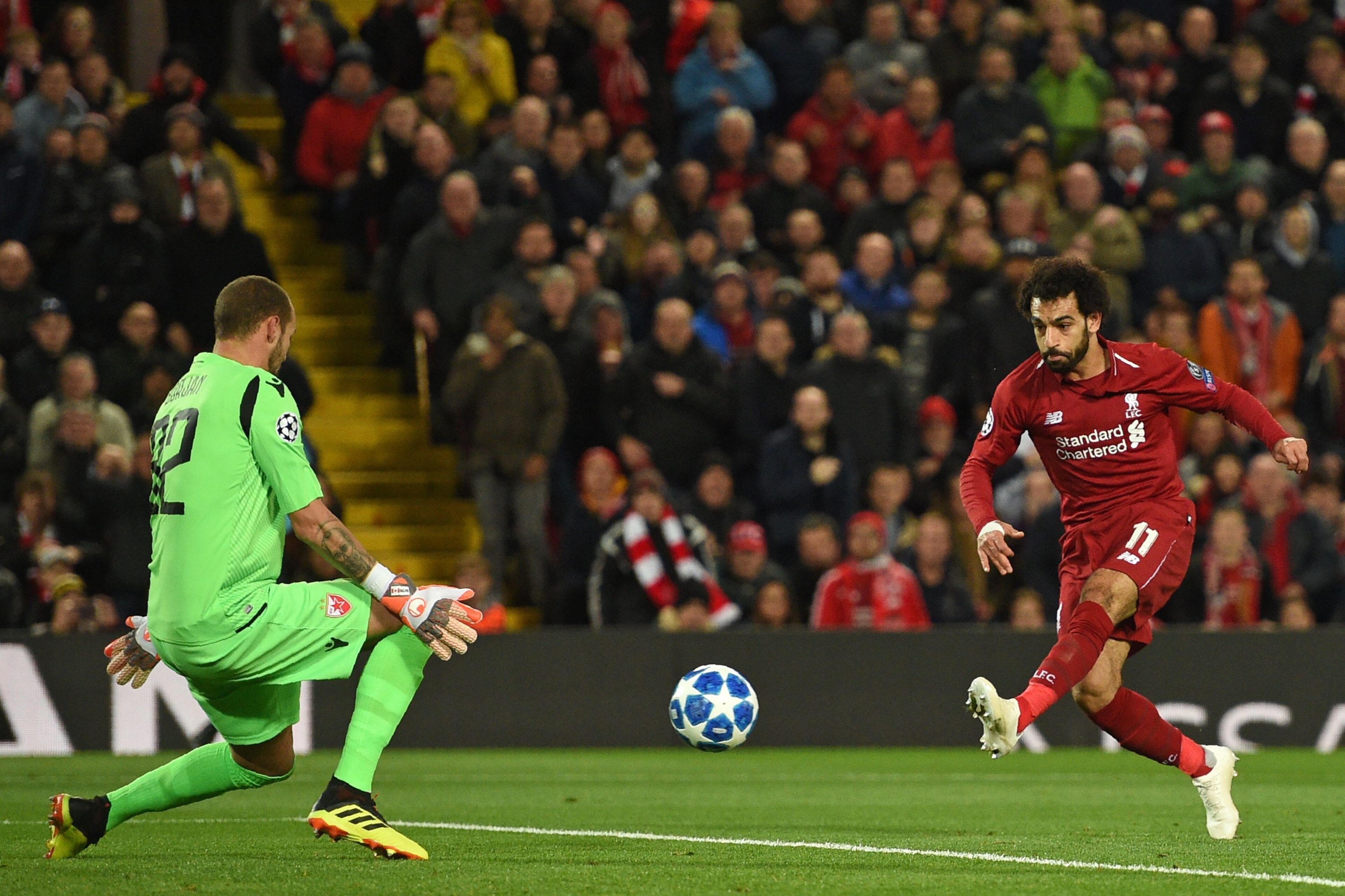 Liverpool's Egyptian midfielder Mohamed Salah (R) has an unsuccessful shot as Red Star Belgrade's Yugoslavian-born Canadian goalkeeper Milan Borjan prepares to make a save during the UEFA Champions League group C football match between Liverpool and Red S Liverpool's Egyptian midfielder Mohamed Salah (R) has an unsuccessful shot as Red Star Belgrade's Yugoslavian-born Canadian goalkeeper Milan Borjan prepares to make a save during the UEFA Champions League group C football match between Liverpool and Red S