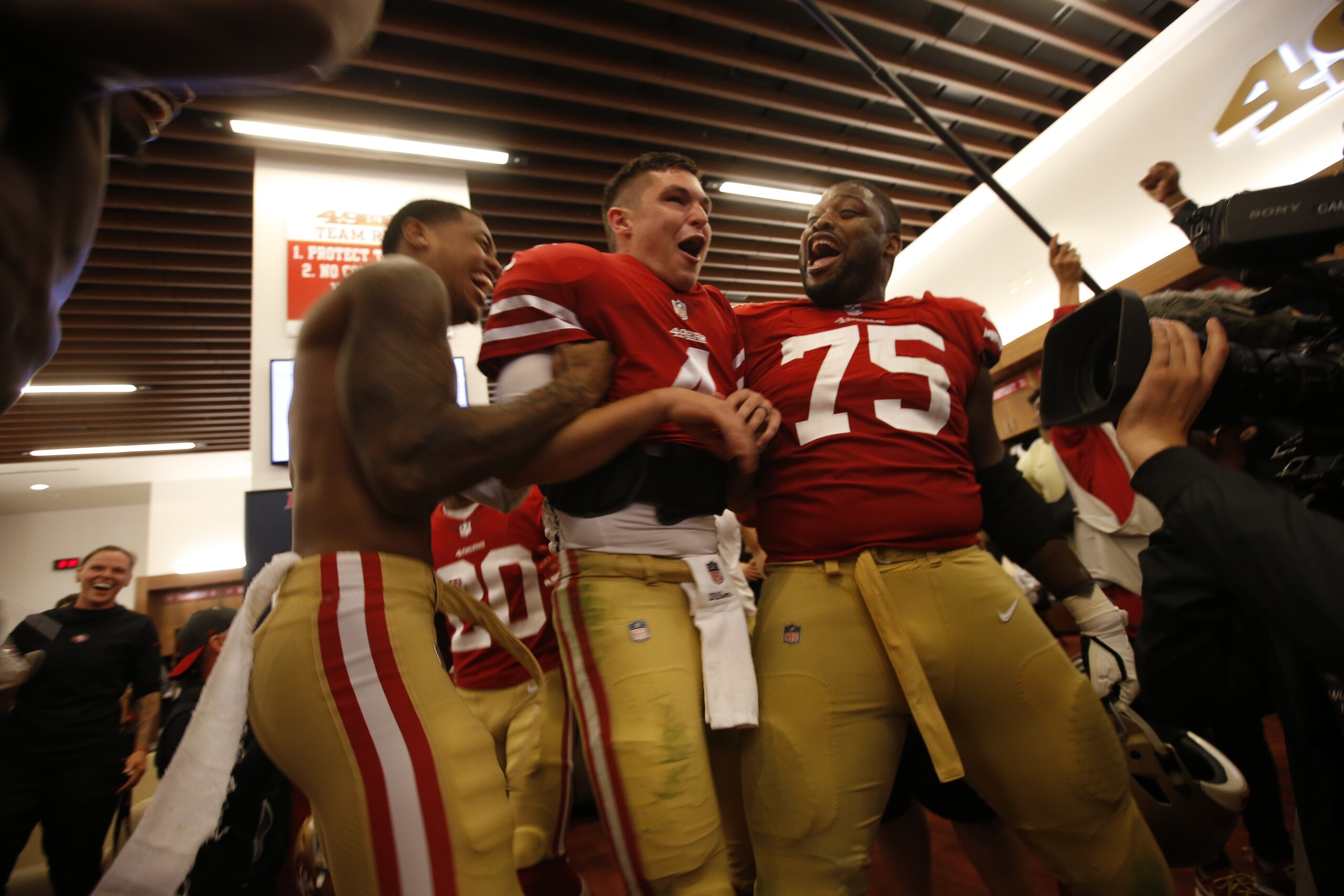 SANTA CLARA, CA - NOVEMBER 1: Nick Mullens #4 of the San Francisco 49ers is celebrate by teammates in the locker room following the game against the Oakland Raiders at Levi's Stadium on November 1, 2018 in Santa Clara, California. The 49ers defeated the R