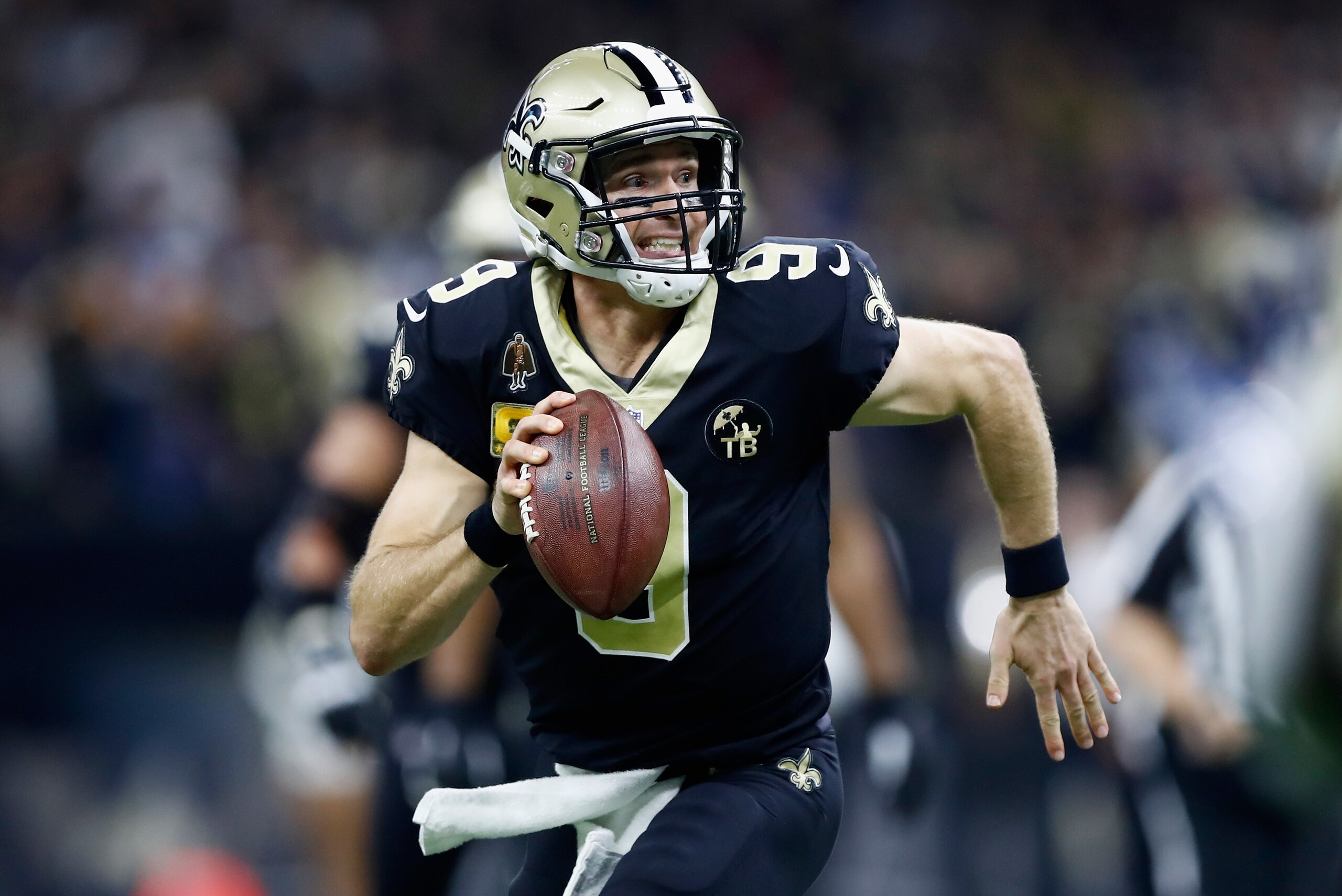 NEW ORLEANS, LA - NOVEMBER 04:  Quarterback Drew Brees #9 of the New Orleans Saints runs with the ball during the second quarter of the game against the Los Angeles Rams at Mercedes-Benz Superdome on November 4, 2018 in New Orleans, Louisiana.  (Photo by 