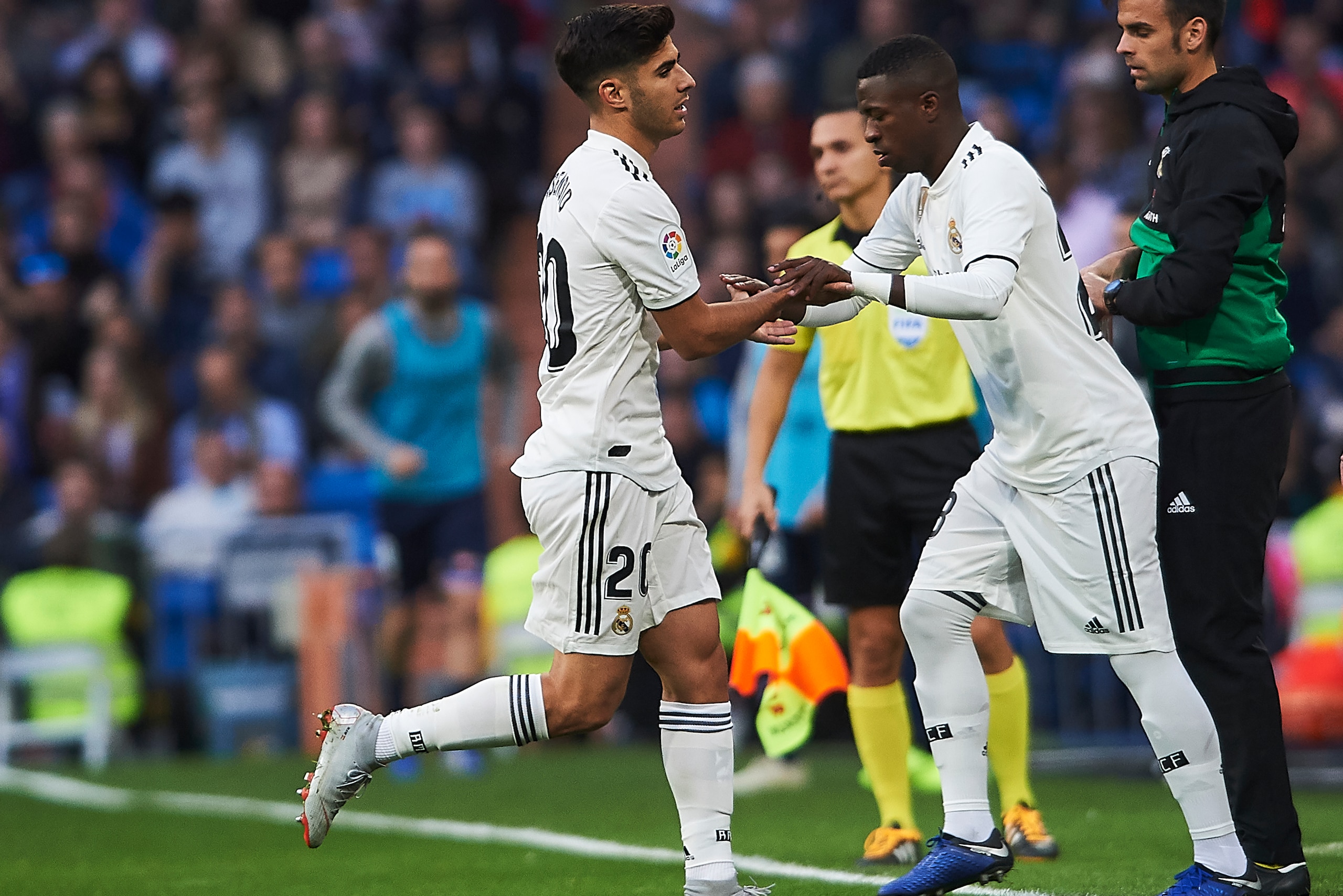 MADRID, SPAIN - NOVEMBER 03:  Marco Asensio and Vinicius Junior of Real Madrid look on during the La Liga match between Real Madrid CF and Real Valladolid CF at Estadio Santiago Bernabeu on November 3, 2018 in Madrid, Spain.  (Photo by Quality Sport Image