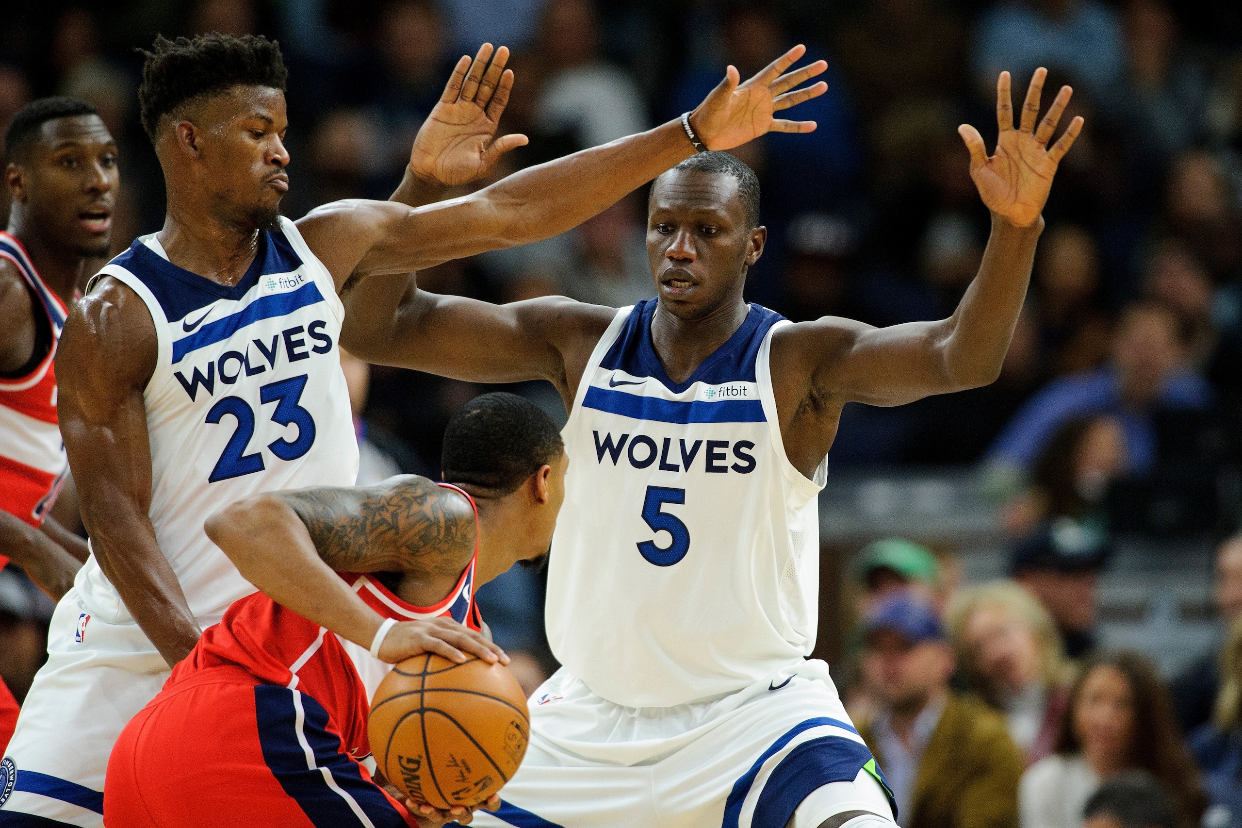 MINNEAPOLIS, MN - NOVEMBER 28: Jimmy Butler #23 and Gorgui Dieng #5 of the Minnesota Timberwolves defend against Bradley Beal #3 of the Washington Wizards during the game on November 28, 2017 at the Target Center in Minneapolis, Minnesota. NOTE TO USER: U