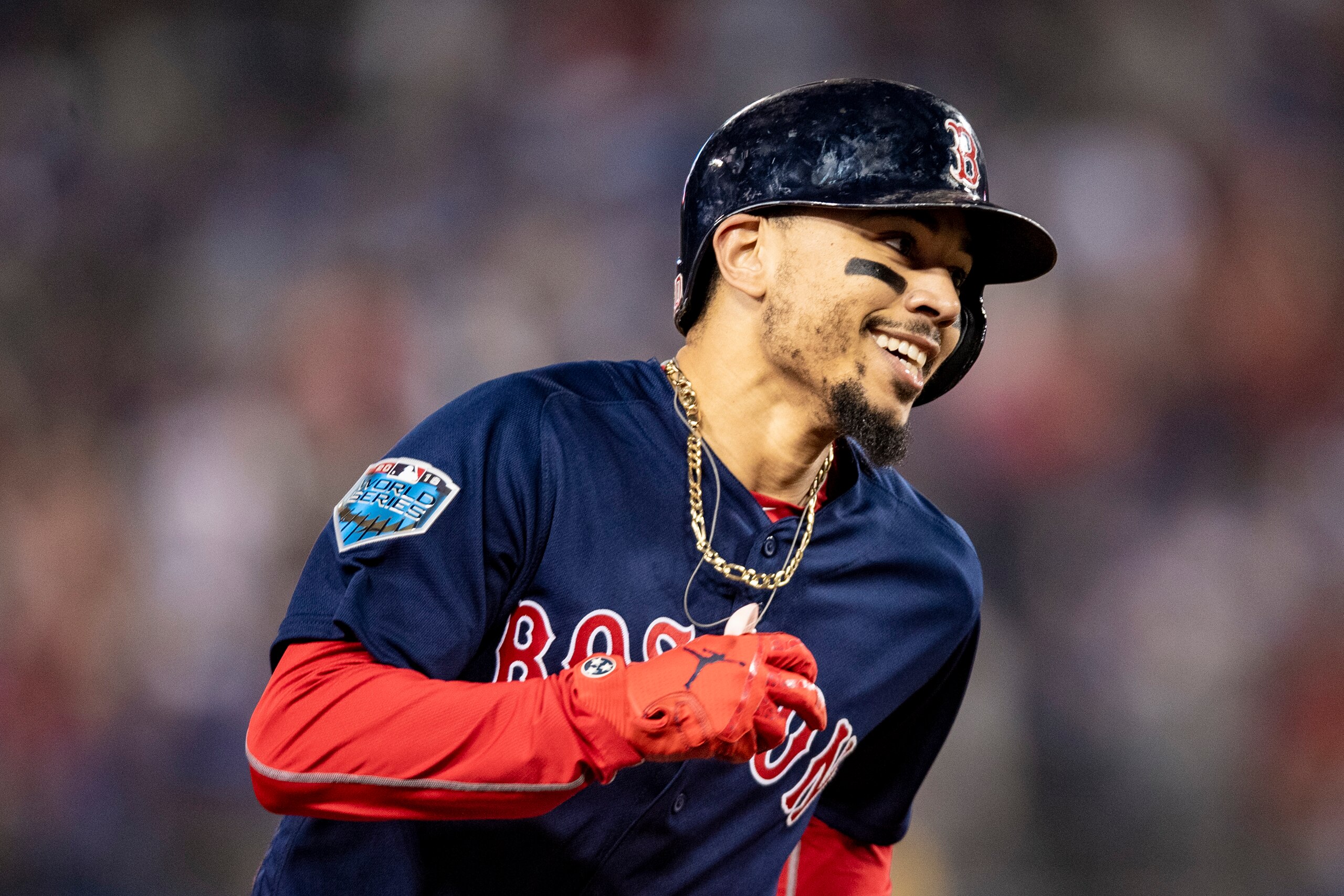 LOS ANGELES, CA - OCTOBER 28: Mookie Betts #50 of the Boston Red Sox reacts as he rounds the bases after hitting a solo home run during the sixth inning of game five of the 2018 World Series against the Los Angeles Dodgers on October 28, 2018 at Dodger St