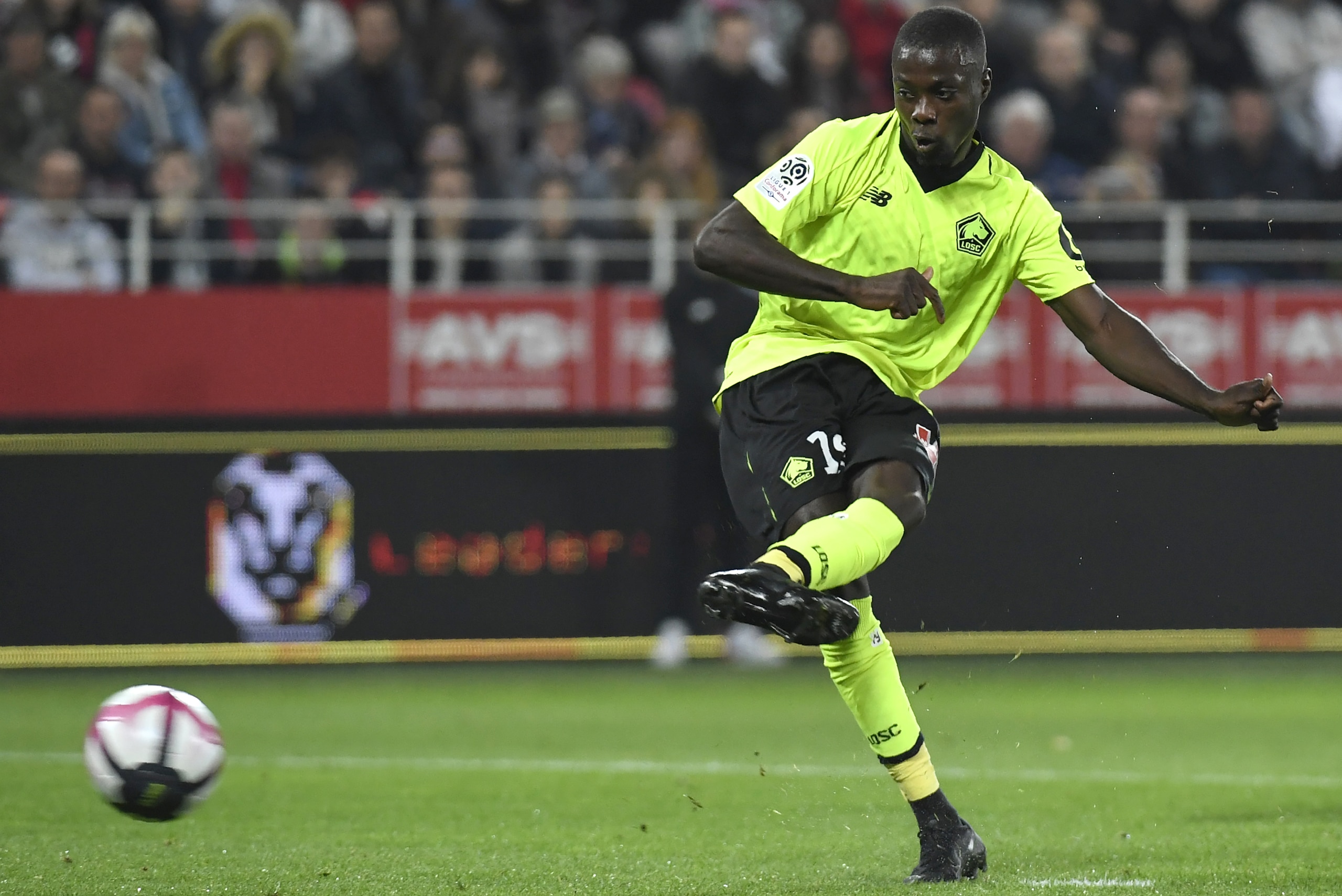 Lille's Ivorian forward Nicolas Pepe shoots and scores a penalty during the French L1 football match between Dijon Football Côte-d'Or and LOSC Lille Association on Octobre 20 , 2018, at the Gaston Gerard Stadium in Dijon, northern France. (Photo by PHILIP Lille's Ivorian forward Nicolas Pepe shoots and scores a penalty during the French L1 football match between Dijon Football Côte-d'Or and LOSC Lille Association on Octobre 20 , 2018, at the Gaston Gerard Stadium in Dijon, northern France. (Photo by PHILIP