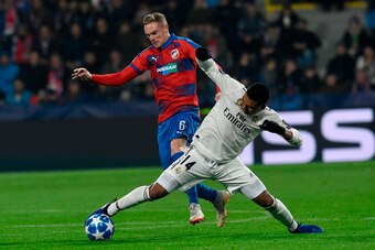 Real Madrid's Brazilian midfielder Casemiro (R) and Viktoria Plzen's Slovak midfielder Roman Prochazka vie for the ball during the UEFA Champions League group G football match Viktoria Plzen v Real Madrid in Plzen, Czech Republic on November 7, 2018. (Pho