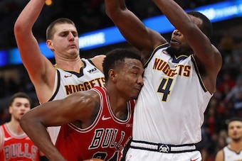 CHICAGO, IL - OCTOBER 31:   Wendell Carter Jr. #34 of the Chicago Bulls gets trapped by Nikola Jokic #15 an Paul Millsap #4 of the Denver Nuggets at the United Center on October 31, 2018 in Chicago, Illinois. The Nuggets defeated the Bulls 108-107 in over
