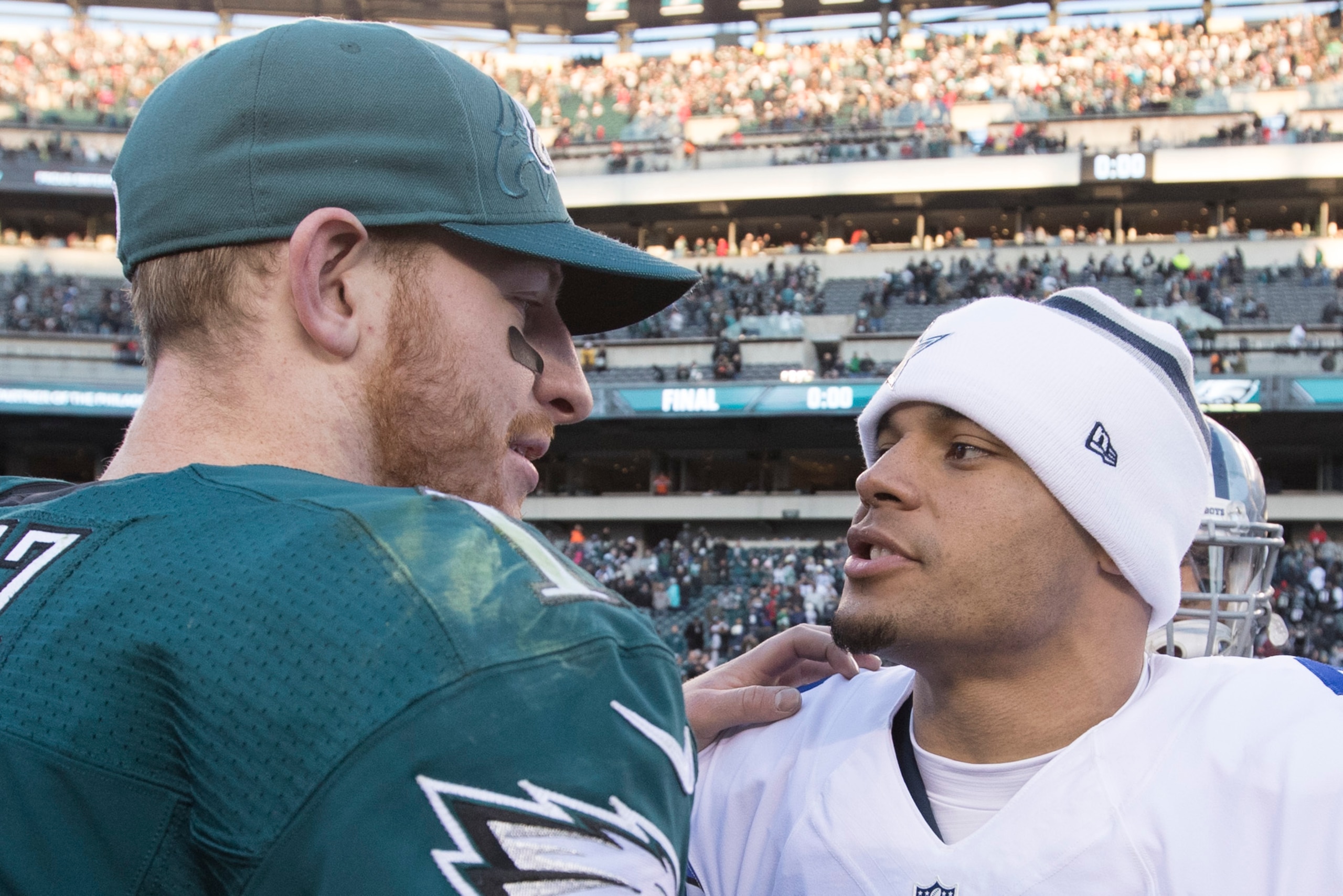 PHILADELPHIA, PA - JANUARY 1: Carson Wentz #11 of the Philadelphia Eagles hugs Dak Prescott #4 of the Dallas Cowboys after the game at Lincoln Financial Field on January 1, 2017 in Philadelphia, Pennsylvania. The Eagles defeated the Cowboys 27-13. (Photo 