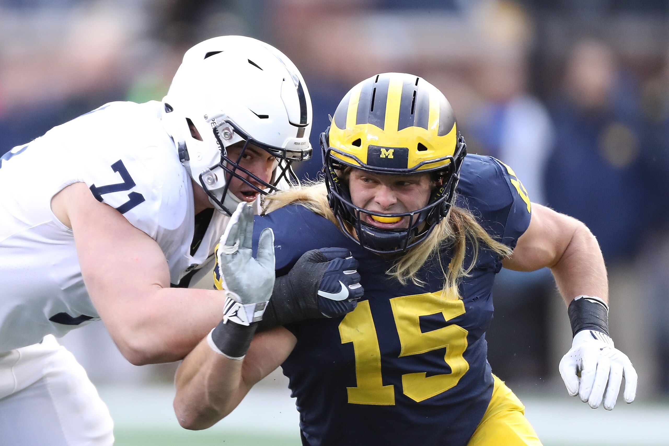 ANN ARBOR, MI - NOVEMBER 03: Chase Winovich #15 of the Michigan Wolverines rushes the quarterback as Will Fries #71 of the Penn State Nittany Lions makes the block during the first quarter of the game against at Michigan Stadium on November 3, 2018 in Ann