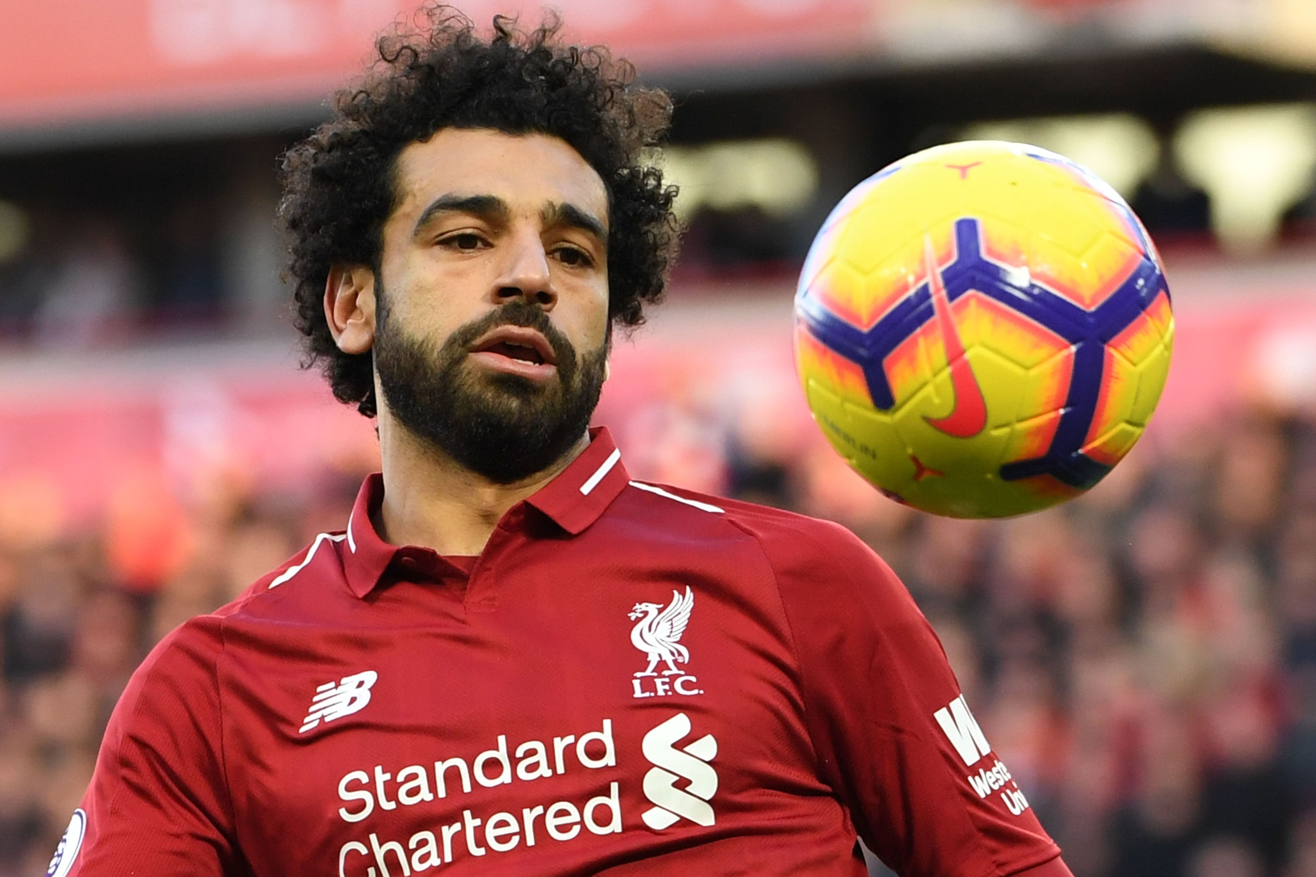 Liverpool's Egyptian midfielder Mohamed Salah eyes the ball during the English Premier League football match between Liverpool and Cardiff City at Anfield in Liverpool, north west England on October 27, 2018. (Photo by Paul ELLIS / AFP) / RESTRICTED TO ED