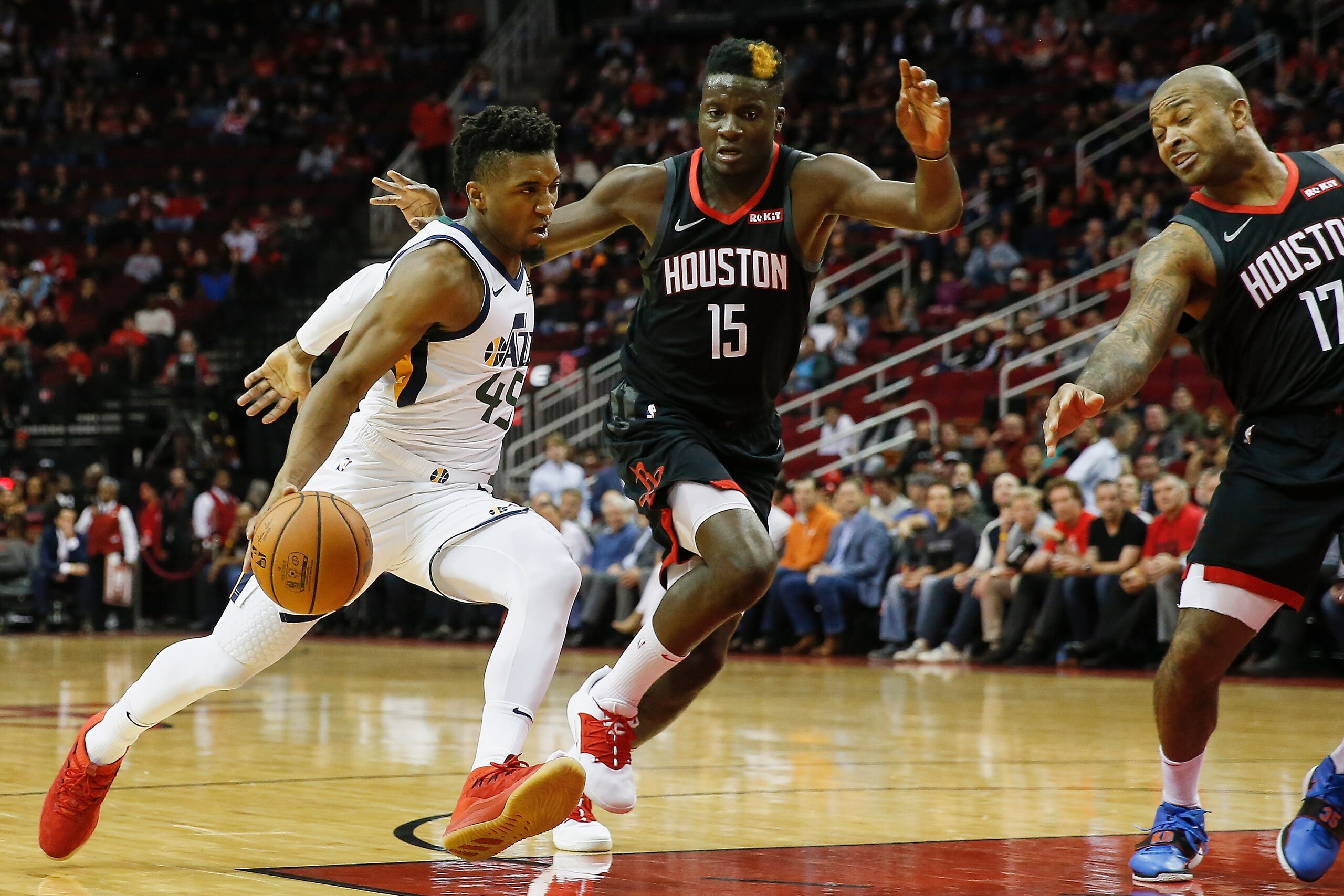 HOUSTON, TX - OCTOBER 24: Donovan Mitchell #45 of the Utah Jazz drives to the basket defended by Clint Capela #15 of the Houston Rockets and PJ Tucker #17 in the first half at Toyota Center on October 24, 2018 in Houston, Texas. NOTE TO USER: User expre HOUSTON, TX - OCTOBER 24: Donovan Mitchell #45 of the Utah Jazz drives to the basket defended by Clint Capela #15 of the Houston Rockets and PJ Tucker #17 in the first half at Toyota Center on October 24, 2018 in Houston, Texas. NOTE TO USER: User expre