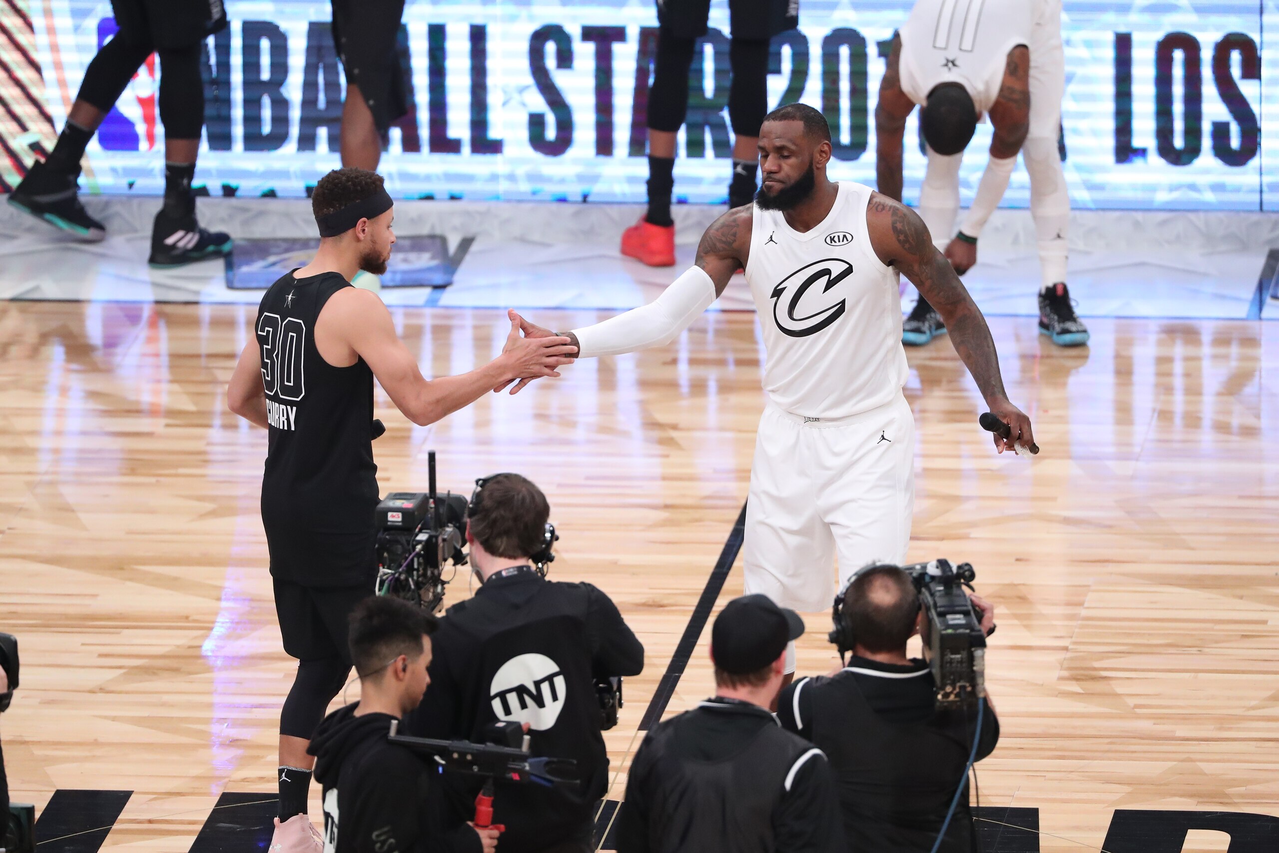 LOS ANGELES, CA - FEBRUARY 18: Stephen Curry #30 of team Stephen and LeBron James #23 of team LeBron speak to the crowd prior to the NBA All-Star Game as a part of 2018 NBA All-Star Weekend at STAPLES Center on February 18, 2018 in Los Angeles, California