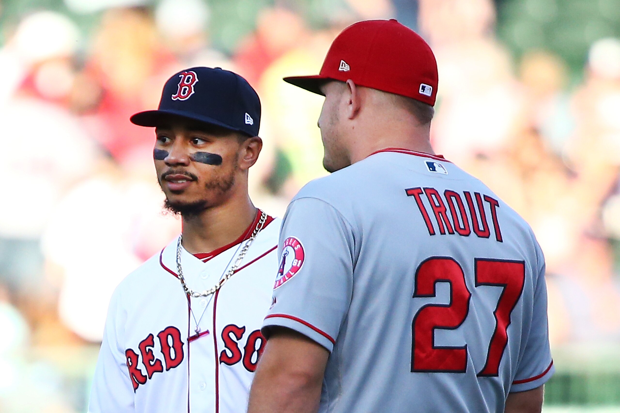 BOSTON, MA - JUNE 26:  Mike Trout #27 of the Los Angeles Angels talks to Mookie Betts #50 of the Boston Red Sox before a game against the Boston Red Sox at Fenway Park on June 26, 2018 in Boston, Massachusetts.  (Photo by Adam Glanzman/Getty Images)