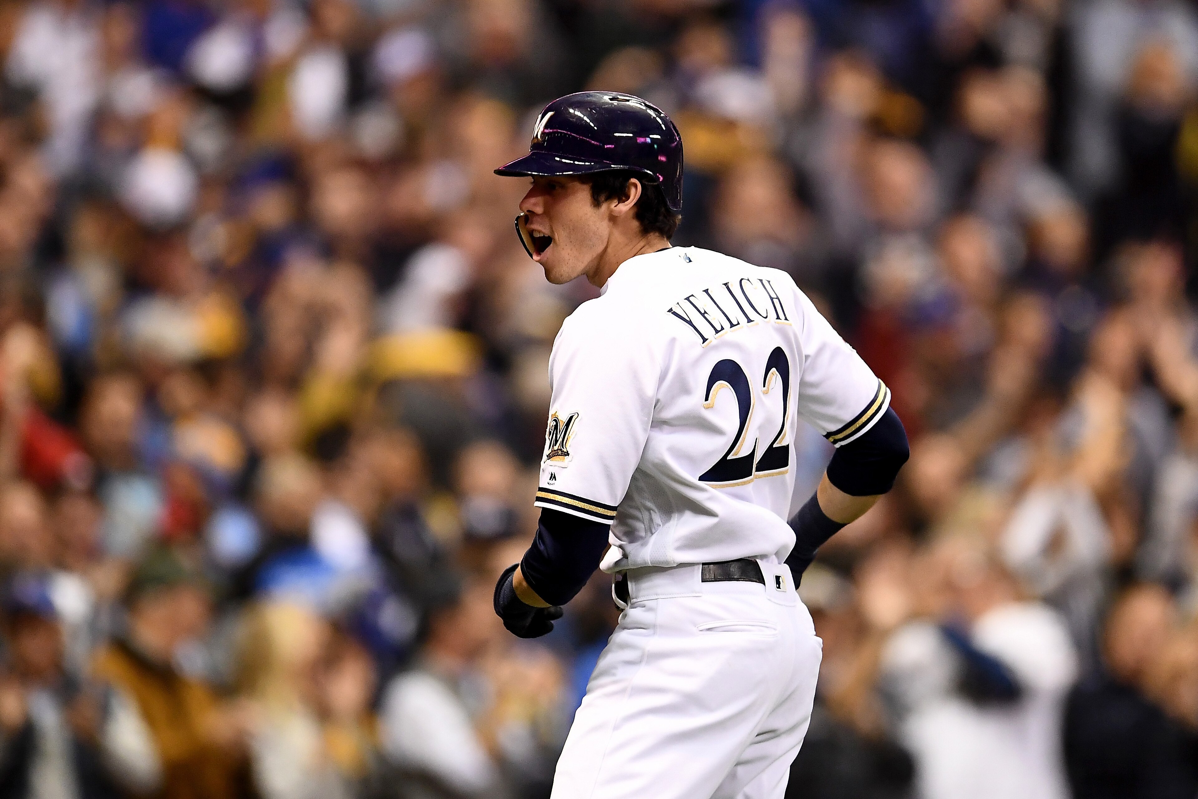 MILWAUKEE, WI - OCTOBER 20:  Christian Yelich #22 of the Milwaukee Brewers rounds the bases after hitting a solo home run against Walker Buehler #21 of the Los Angeles Dodgers during the first inning in Game Six of the National League Championship Series