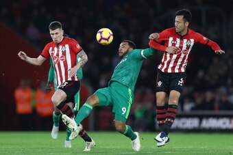 SOUTHAMPTON, ENGLAND - NOVEMBER 10:  Troy Deeney of Watford  battles for possession with  Maya Yoshida and Pierre-Emile Hojbjerg of Southampton during the Premier League match between Southampton FC and Watford FC at St Mary's Stadium on November 10, 2018