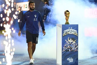 France's forward Nabil Fekir walks past the 2018 World Cup trophy before the lap of honour at the end of the UEFA Nations League football match between France and Netherlands at the Stade de France stadium, in Saint-Denis, northern of Paris, on September 