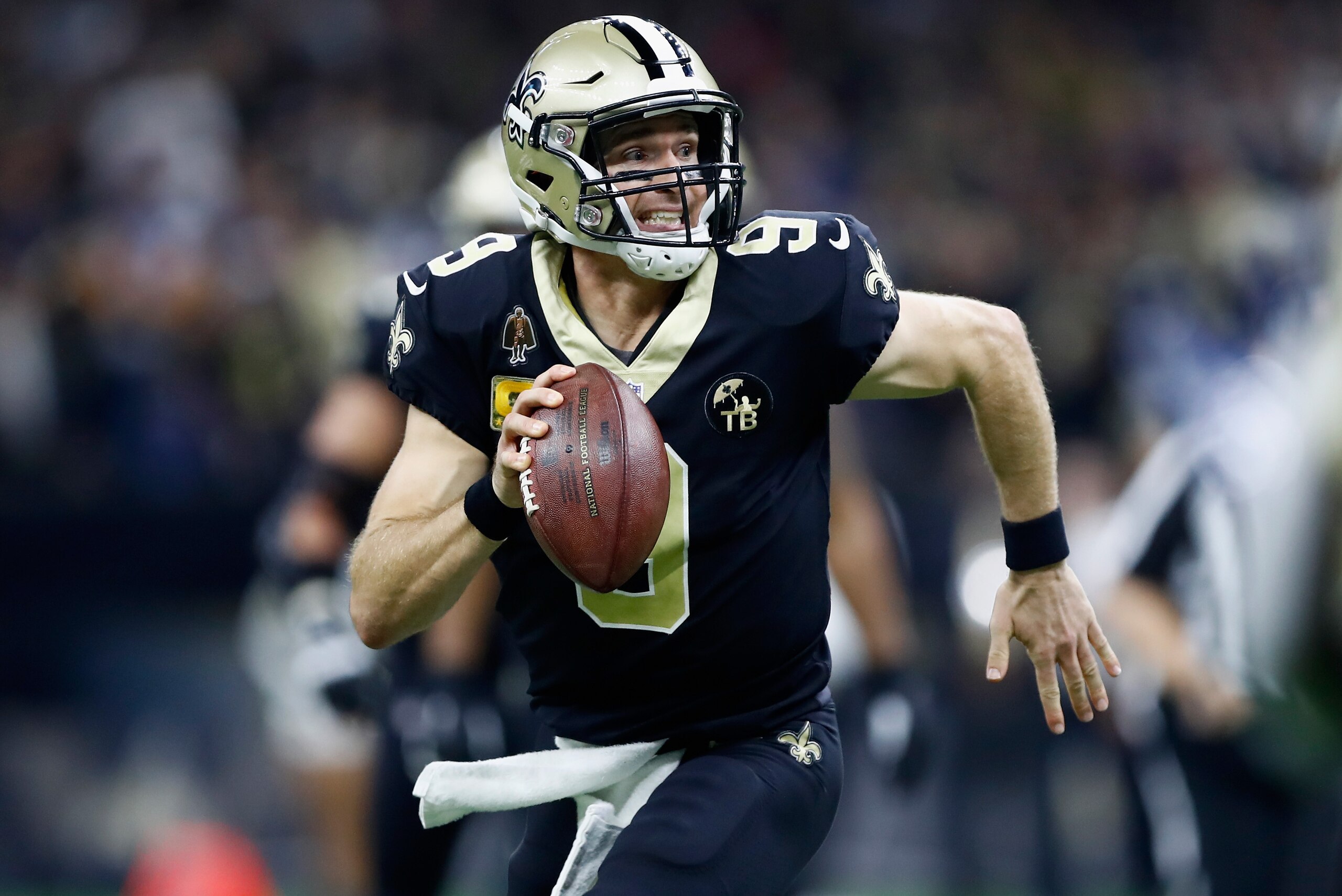 NEW ORLEANS, LA - NOVEMBER 04:  Quarterback Drew Brees #9 of the New Orleans Saints runs with the ball during the second quarter of the game against the Los Angeles Rams at Mercedes-Benz Superdome on November 4, 2018 in New Orleans, Louisiana.  (Photo by 