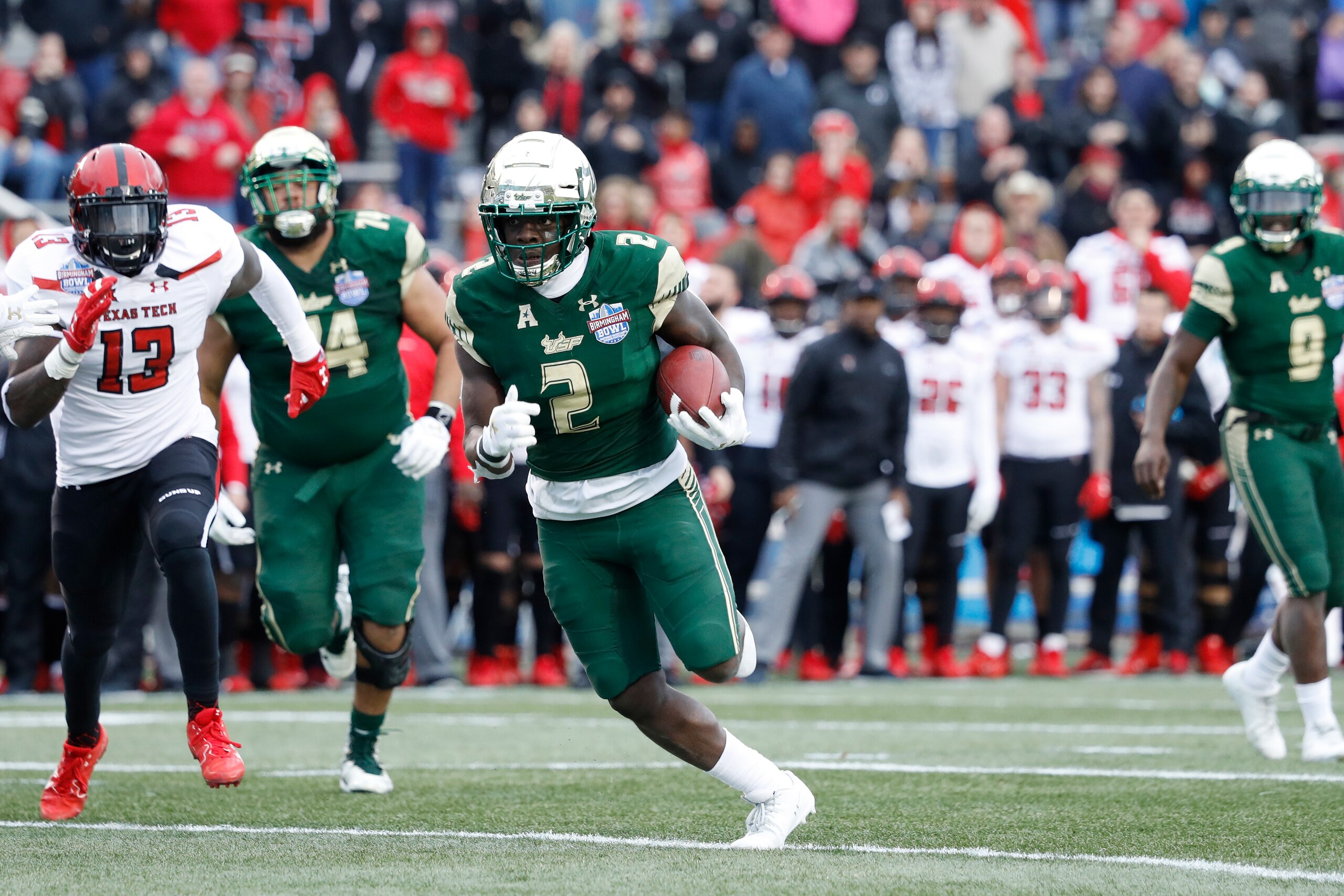 BIRMINGHAM, AL - DECEMBER 23: D'Ernest Johnson #2 of the South Florida Bulls runs with the ball during the Birmingham Bowl against the Texas Tech Red Raiders at Legion Field on December 23, 2017 in Birmingham, Alabama. South Florida won 38-34. (Photo by J