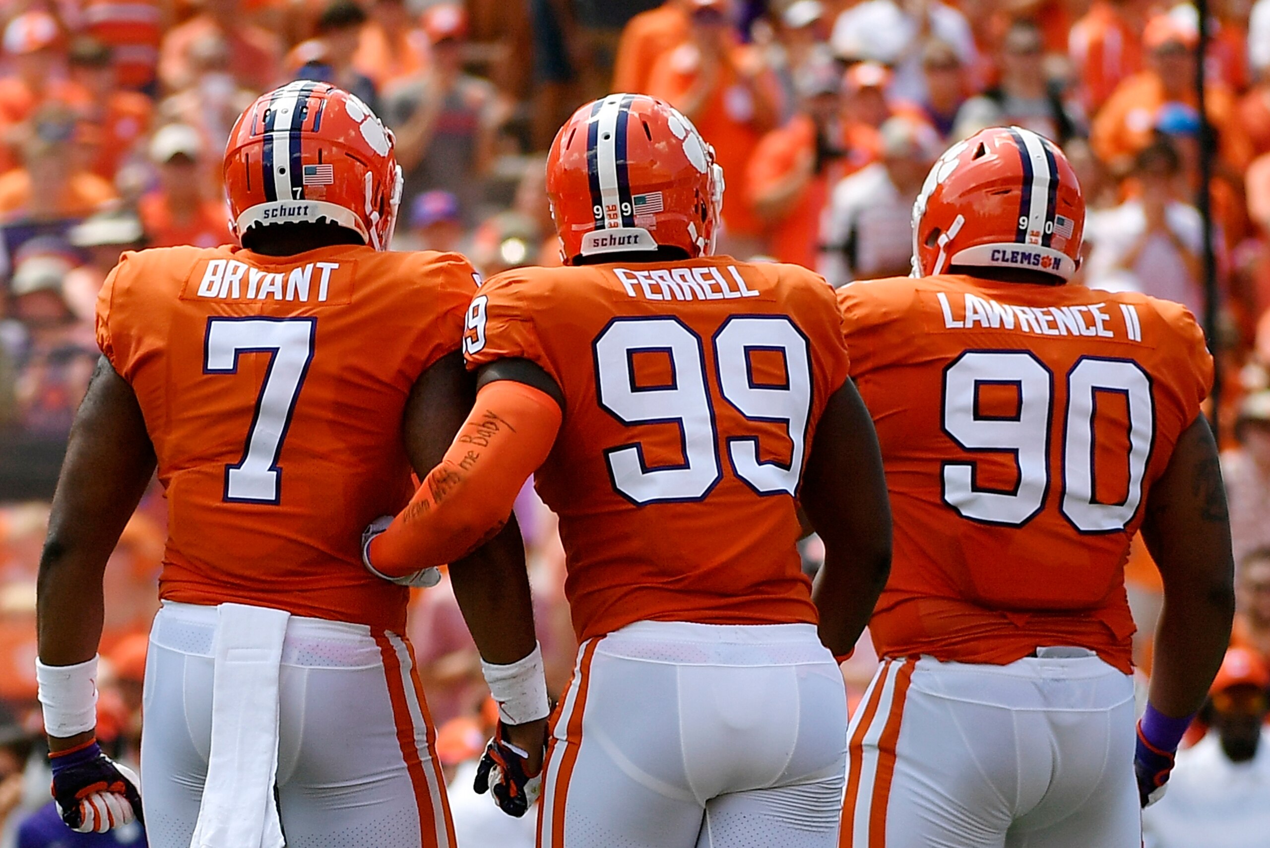 CLEMSON, SC - SEPTEMBER 01: Defensive end Austin Bryant #7, defensive end Clelin Ferrell #99, and defensive tackle Dexter Lawrence #90 of the Clemson Tigers walk to the sideline during the Tigers' football game against the Furman Paladins at Clemson Memor
