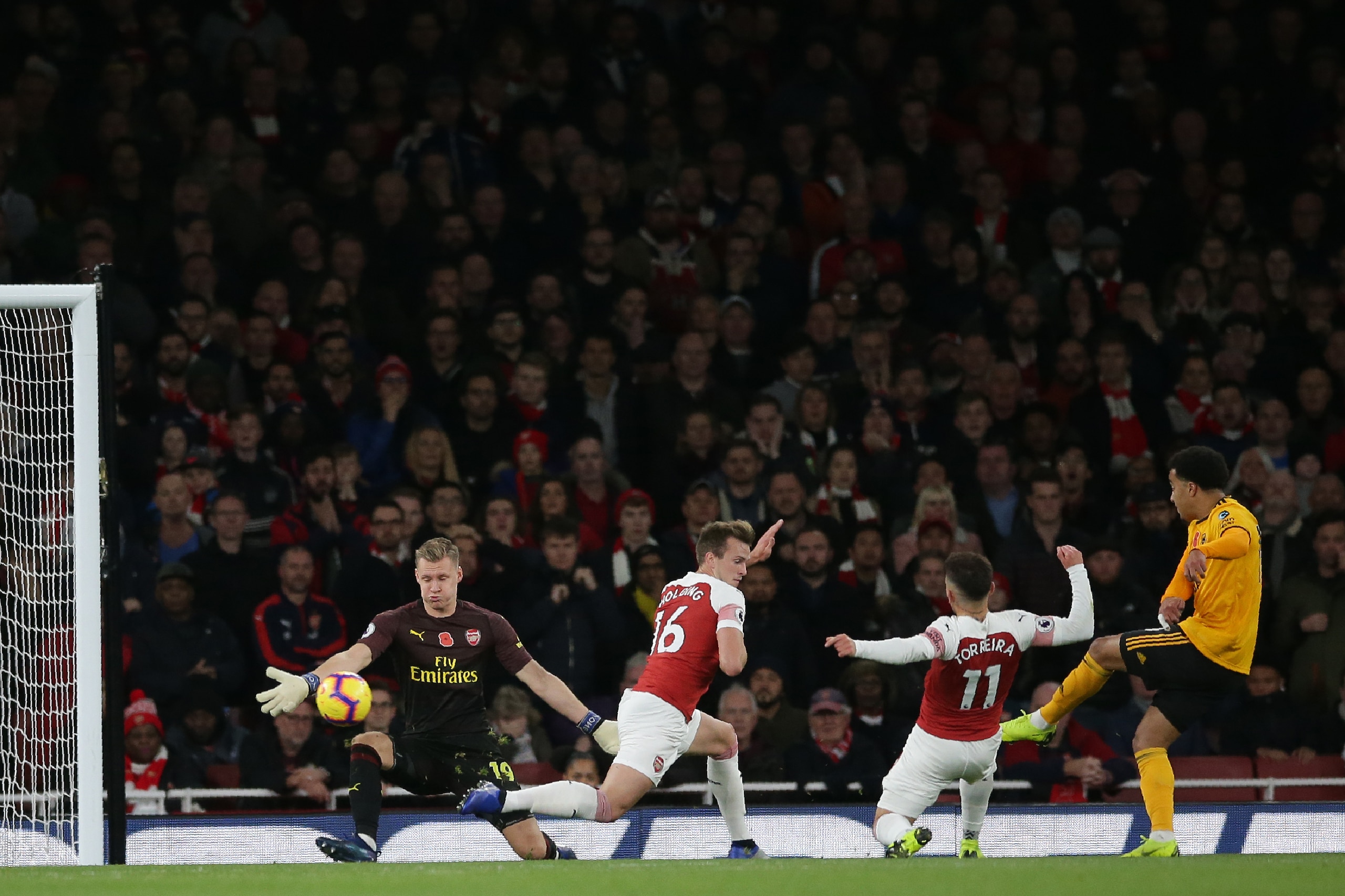 Wolverhampton Wanderers' Portuguese striker Helder Costa (R) has this shot saved by Arsenal's German goalkeeper Bernd Leno (L) during the English Premier League football match between Arsenal and Wolverhampton Wanderers at the Emirates Stadium in London o