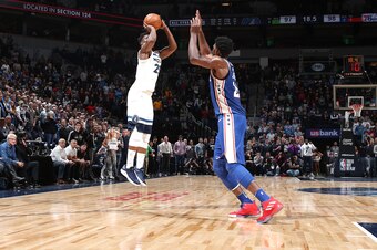 MINNEAPOLIS, MN - DECEMBER 12:  Jimmy Butler #23 of the Minnesota Timberwolves shoots a three pointer against Joel Embiid #21 of the Philadelphia 76ers on December 12, 2017 at Target Center in Minneapolis, Minnesota. NOTE TO USER: User expressly acknowled