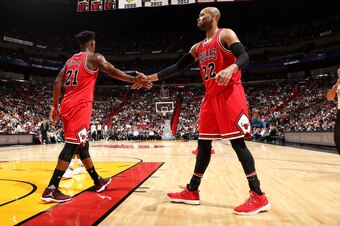 MIAMI, FL - NOVEMBER 10: Jimmy Butler #21 and Taj Gibson #22 of the Chicago Bulls high five each other during the game against the Miami Heat on November 10, 2016 at AmericanAirlines Arena in Miami, Florida. NOTE TO USER: User expressly acknowledges and a