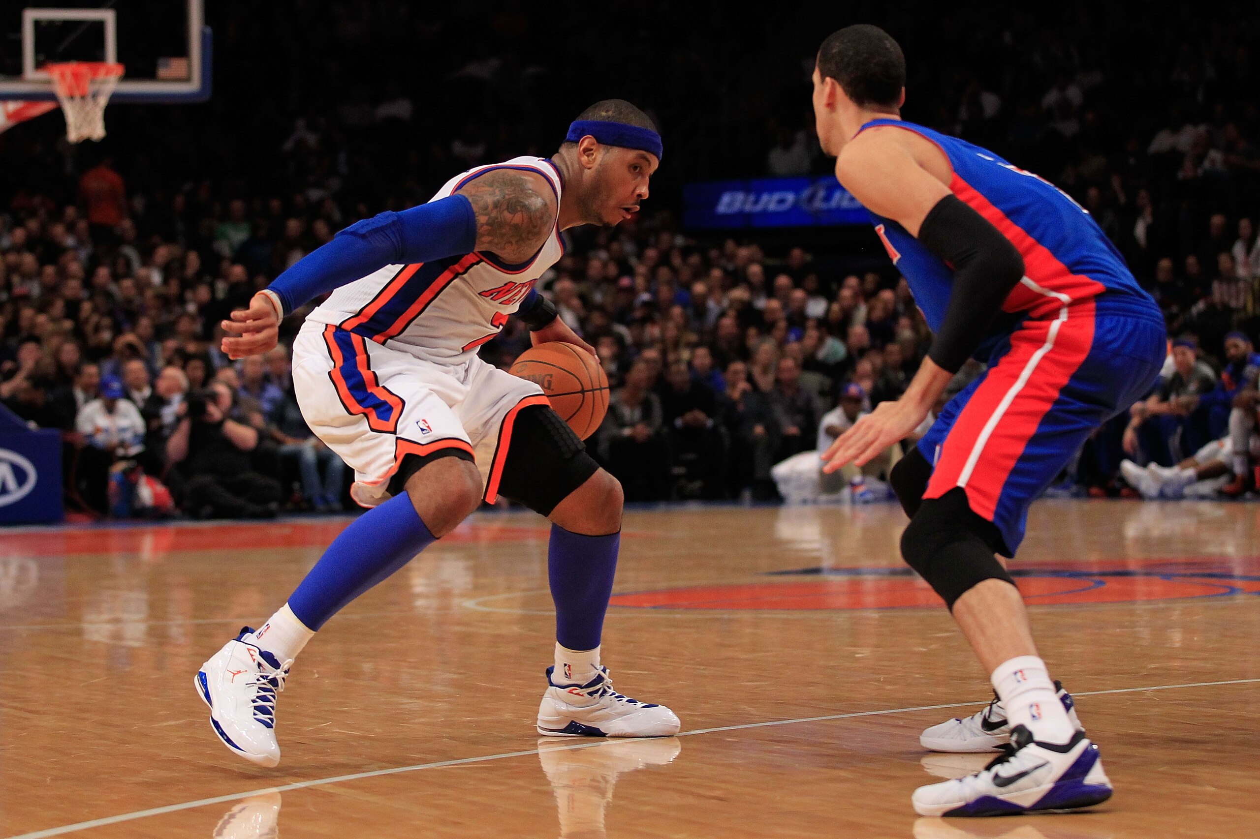 NEW YORK, NY - JANUARY 31:  Carmelo Anthony #7 of the New York Knicks drives against Austin Daye #5 of the Detroit Pistons at Madison Square Garden on January 31, 2012 in New York City.  NOTE TO USER: User expressly acknowledges and agrees that, by downlo
