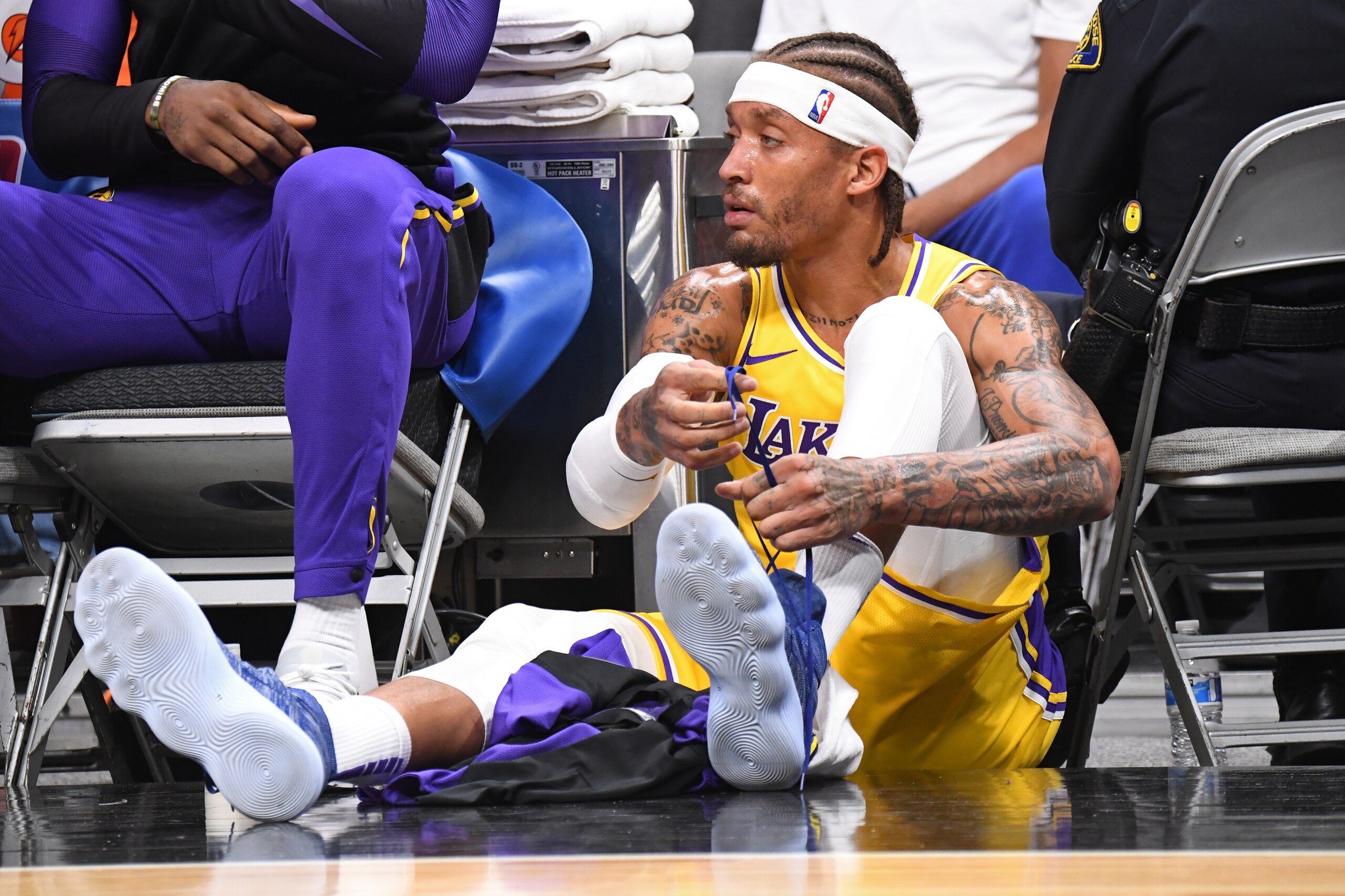 SAN JOSE, CA - OCTOBER 12: Michael Beasley #11 of the Los Angeles Lakers ties his sneakers during a pre-season game against the Golden State Warriors on October 12, 2018 at the SAP Center in San Jose, California. NOTE TO USER: User expressly acknowledges 