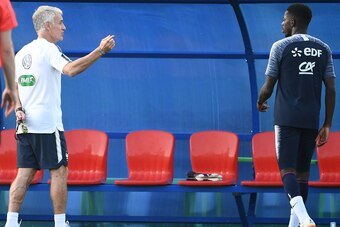 France's head coach Didier Deschamps speaks to France's forward Ousmane Dembele (R) during a friendly football match against a selection of 19-year-old players from Spartak Moscow at the Glebovets stadium in Istra, some 70 km west of Moscow on June 22, 20