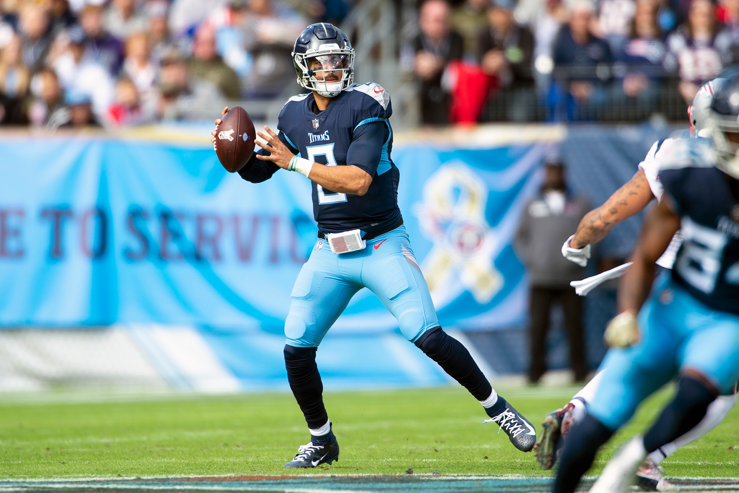 NASHVILLE, TN - NOVEMBER 11:  Quarterback Marcus Mariota #8 of the Tennessee Titans passes during a NFL game against the New England Patriots at Nissan Stadium on November 11, 2018 in Nashville, Tennessee.  (Photo by Ronald C. Modra/Sports Imagery/Getty I