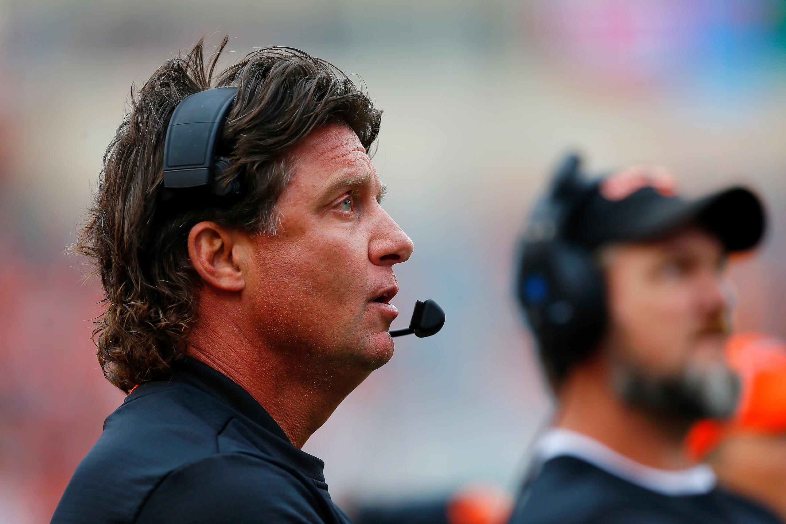 STILLWATER, OK - OCTOBER 6: Head coach Mike Gundy of the Oklahoma State Cowboys watches a replay during a game against the Iowa State Cyclones on October 6, 2018 at Boone Pickens Stadium in Stillwater, Oklahoma. Iowa State won 48-42. (Photo by Brian Ba STILLWATER, OK - OCTOBER 6: Head coach Mike Gundy of the Oklahoma State Cowboys watches a replay during a game against the Iowa State Cyclones on October 6, 2018 at Boone Pickens Stadium in Stillwater, Oklahoma. Iowa State won 48-42. (Photo by Brian Ba