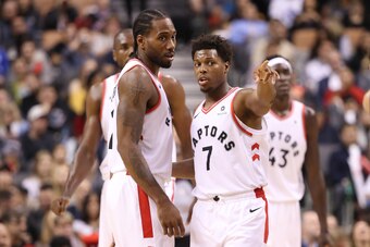 TORONTO, ON - OCTOBER 26: Kyle Lowry #7 of the Toronto Raptors talks to Kawhi Leonard #2 against the Dallas Mavericks at Scotiabank Arena on October 26, 2018 in Toronto, Canada. NOTE TO USER: User expressly acknowledges and agrees that, by downloading and