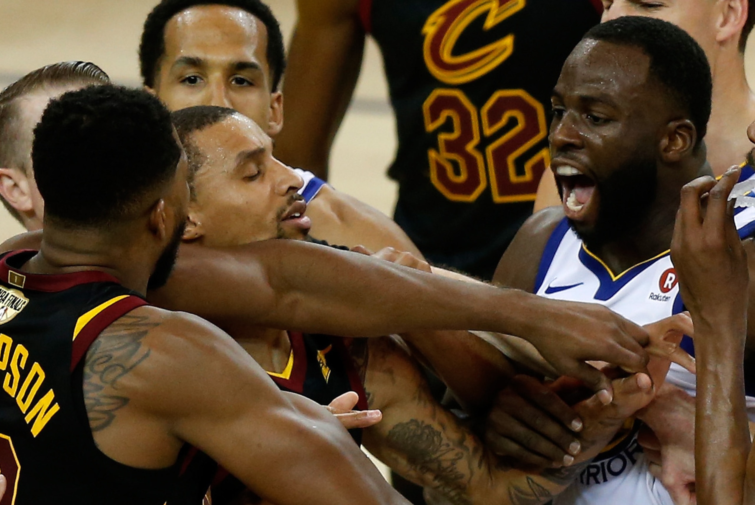 OAKLAND, CA - MAY 31:  Tristan Thompson #13 of the Cleveland Cavaliers and Draymond Green #23 of the Golden State Warriors exchange words in overtime during Game 1 of the 2018 NBA Finals at ORACLE Arena on May 31, 2018 in Oakland, California. NOTE TO USER