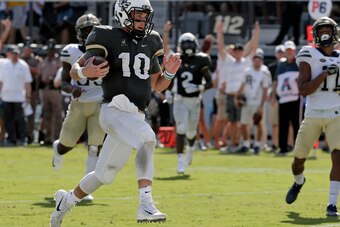 McKenzie Milton on the run in 45-14  victory over Pittsburgh.