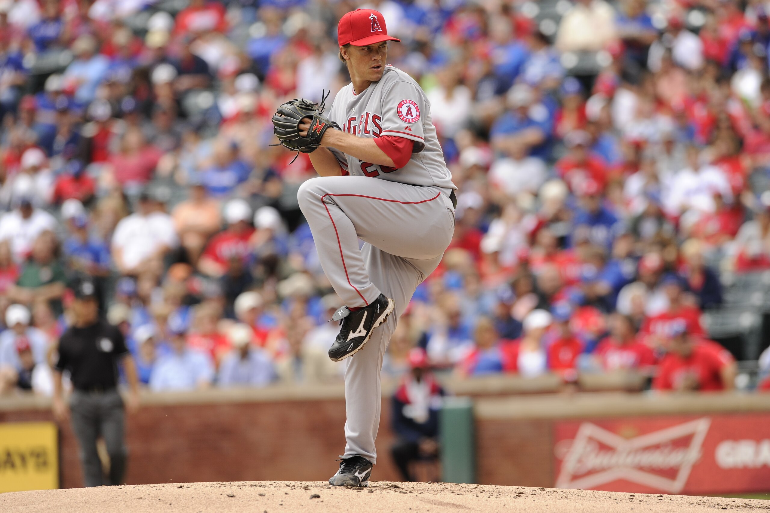 ARLINGTON, TX - SEPTEMBER 30:  Zack Greinke #23 of the Los Angeles Angels of Anaheim pitches in game one of a doubleheader against the Texas Rangers at Rangers Ballpark on September 30, 2012 in Arlington, Texas.  The Los Angeles Angels of Anaheim defeated
