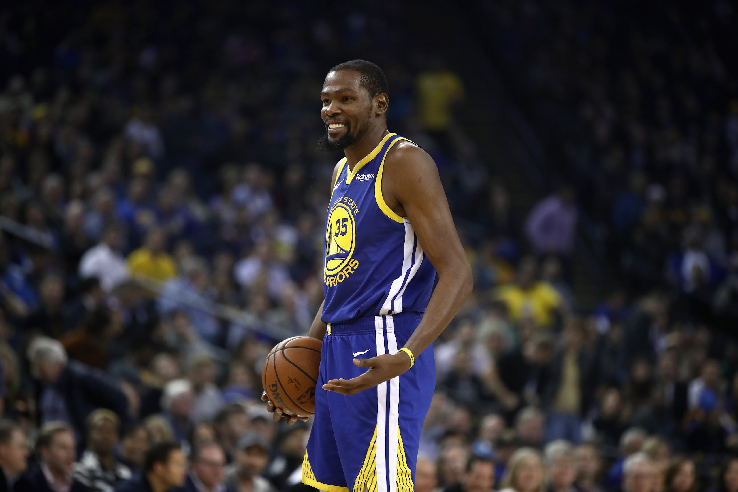 OAKLAND, CA - NOVEMBER 13:  Kevin Durant #35 of the Golden State Warriors smiles after he was called for an offensive foul against the Atlanta Hawks at ORACLE Arena on November 13, 2018 in Oakland, California.  NOTE TO USER: User expressly acknowledges an