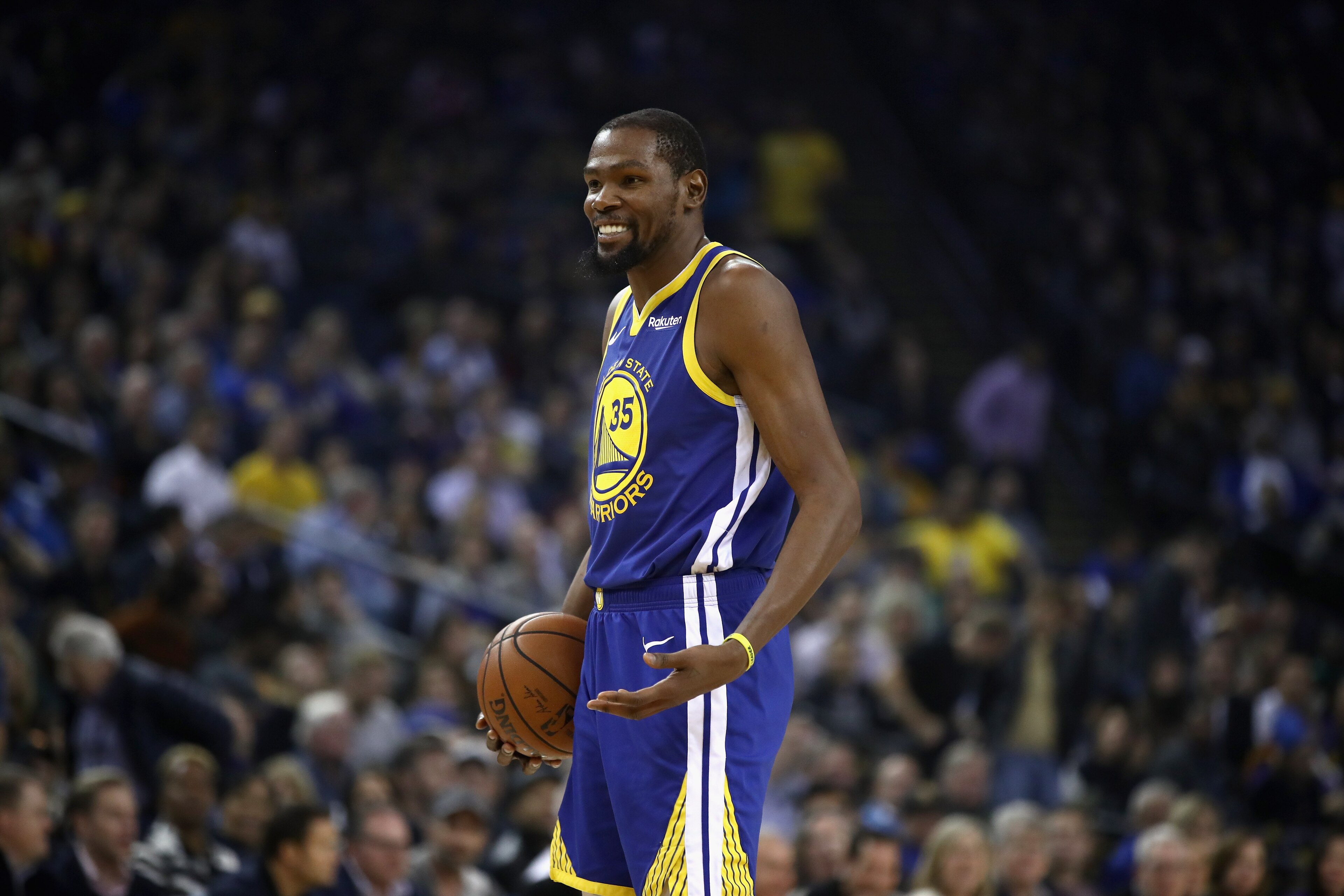 OAKLAND, CA - NOVEMBER 13:  Kevin Durant #35 of the Golden State Warriors smiles after he was called for an offensive foul against the Atlanta Hawks at ORACLE Arena on November 13, 2018 in Oakland, California.  NOTE TO USER: User expressly acknowledges an