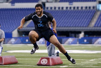 INDIANAPOLIS, IN - FEBRUARY 24: Former Pittsburgh defensive lineman Aaron Donald takes part in position drills during the 2014 NFL Combine at Lucas Oil Stadium on February 24, 2014 in Indianapolis, Indiana. (Photo by Joe Robbins/Getty Images)