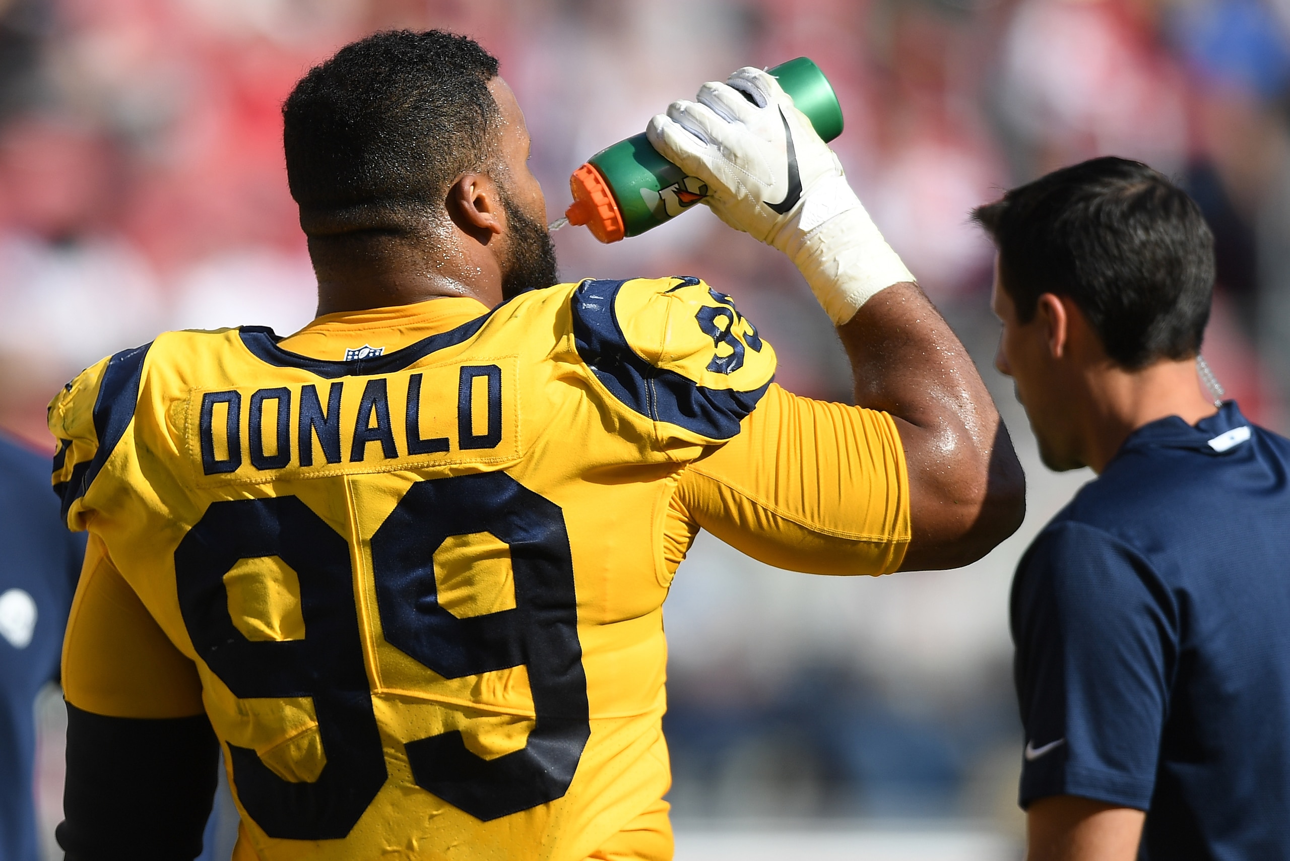 SANTA CLARA, CA - OCTOBER 21: Aaron Donald #99 of the Los Angeles Rams looks on drinking water against the San Francisco 49ers during the third quarter of their NFL football game at Levi's Stadium on October 21, 2018 in Santa Clara, California. (Photo b SANTA CLARA, CA - OCTOBER 21: Aaron Donald #99 of the Los Angeles Rams looks on drinking water against the San Francisco 49ers during the third quarter of their NFL football game at Levi's Stadium on October 21, 2018 in Santa Clara, California. (Photo b