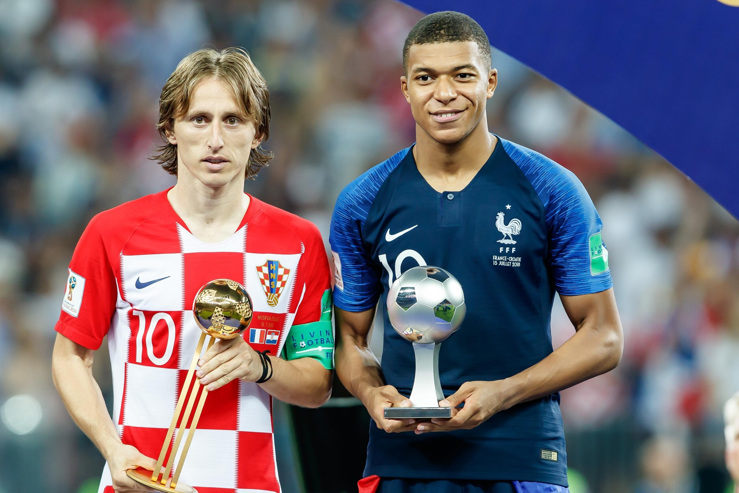 MOSCOW, RUSSIA - JULY 15: Luka Modric of Croatia and Kylian Mbappe of France pose with the Golden Ball Award trophy and the Young Player Award trophy, during the 2018 FIFA World Cup Russia Final between France and Croatia at Luzhniki Stadium on July 15, 2 MOSCOW, RUSSIA - JULY 15: Luka Modric of Croatia and Kylian Mbappe of France pose with the Golden Ball Award trophy and the Young Player Award trophy, during the 2018 FIFA World Cup Russia Final between France and Croatia at Luzhniki Stadium on July 15, 2